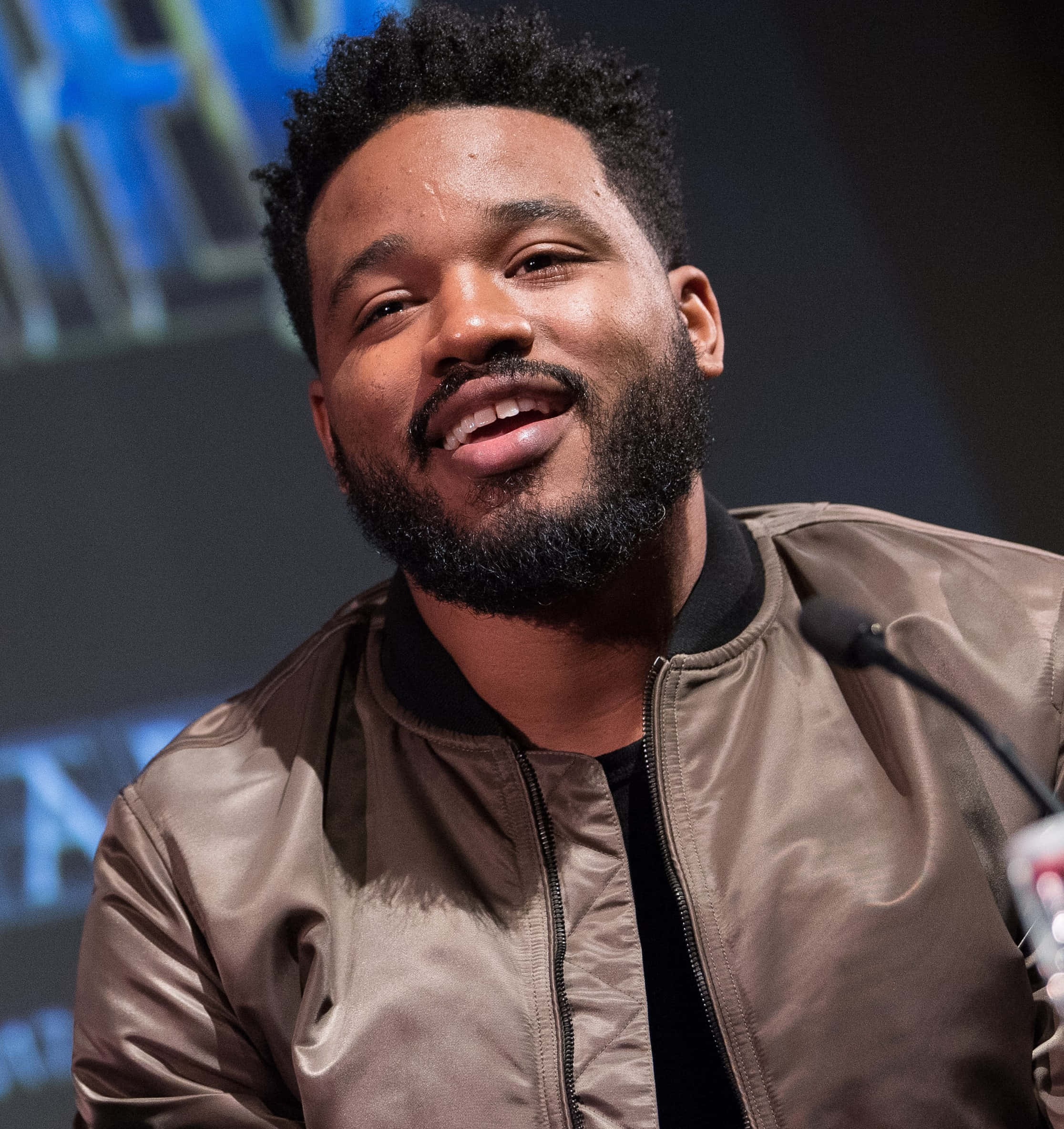 Ryan Coogler, brown bomber jacket, blue screen, Full HD Phone Wallpaper