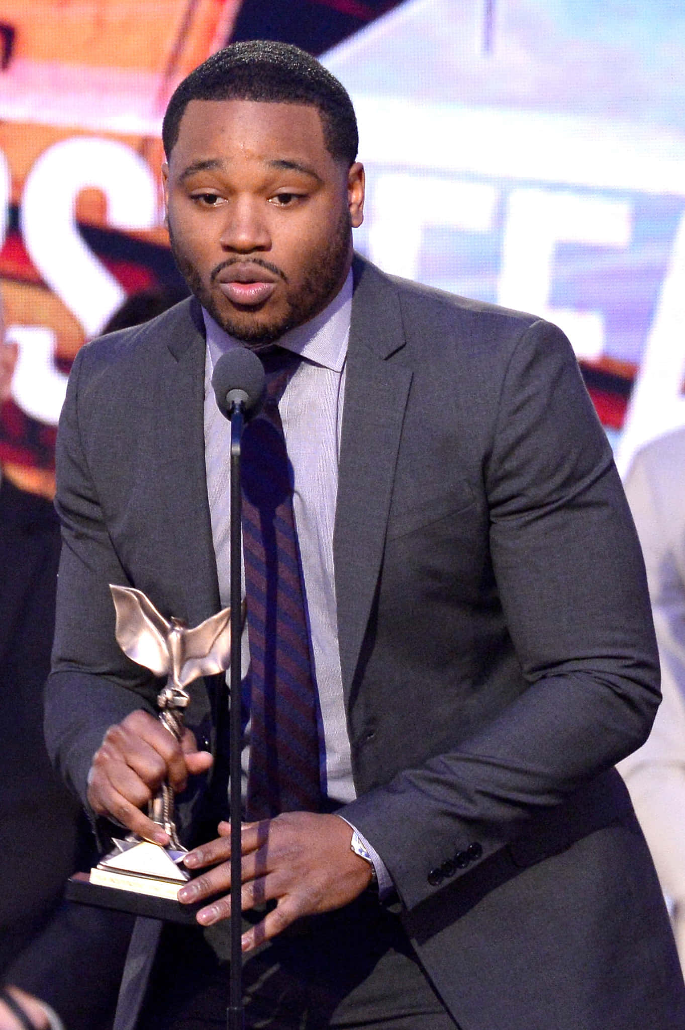 Ryan Coogler, dark suit, metallic winged award, Full HD Phone Wallpaper