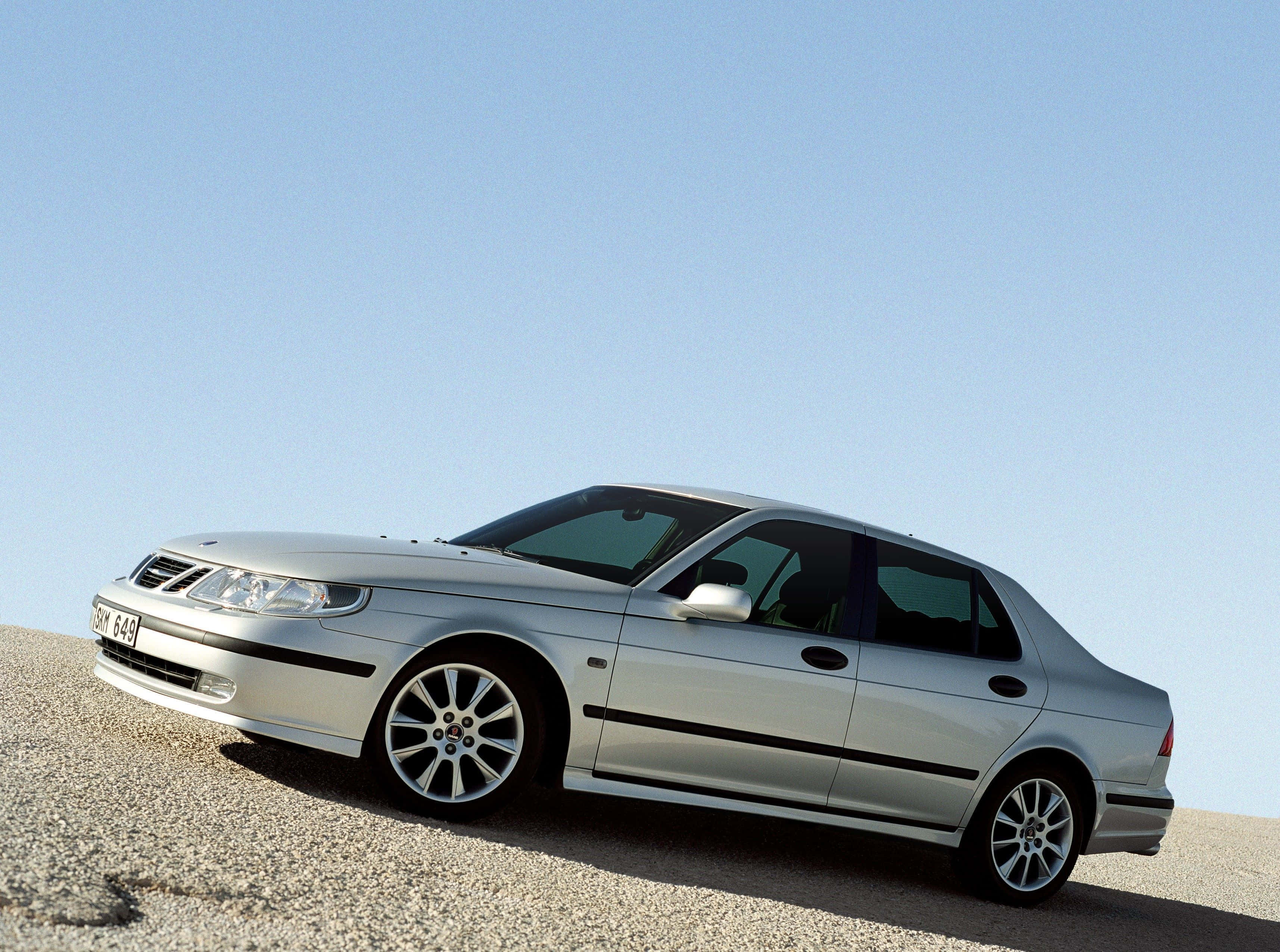 Saab 9-5, silver, gravel slope, 2K Desktop Wallpaper