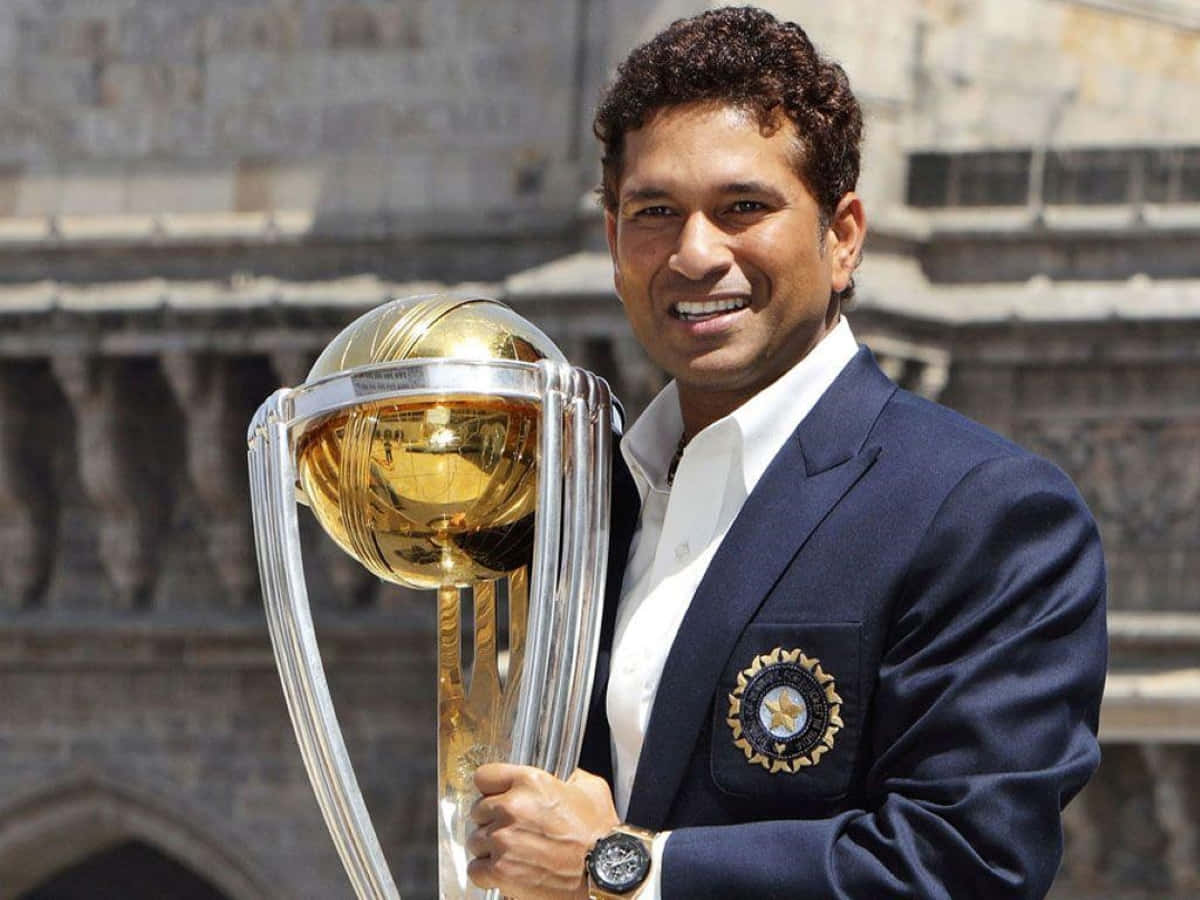 Sachin Tendulkar, navy blazer, gleaming golden cricket trophy, SD Desktop Wallpaper