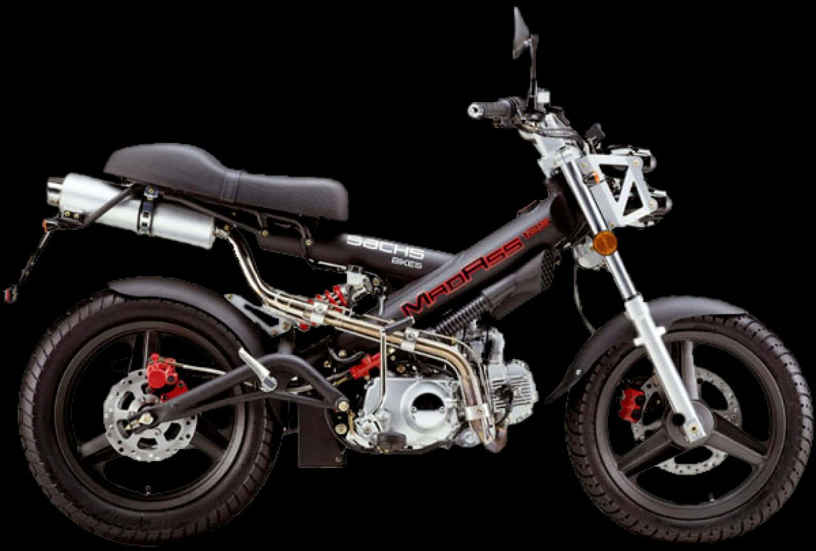 A sleek black and silver dirt bike with red accents stands isolated against a pure black background showcasing its rugged mechanical details., HD Desktop Wallpaper