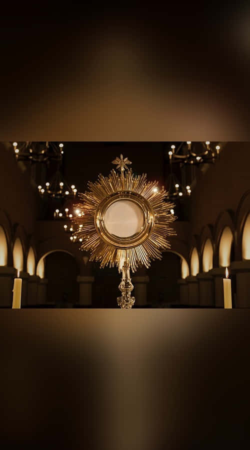 Sacrament 500 x 900, golden monstrance, dimly lit cathedral, SD Phone Wallpaper