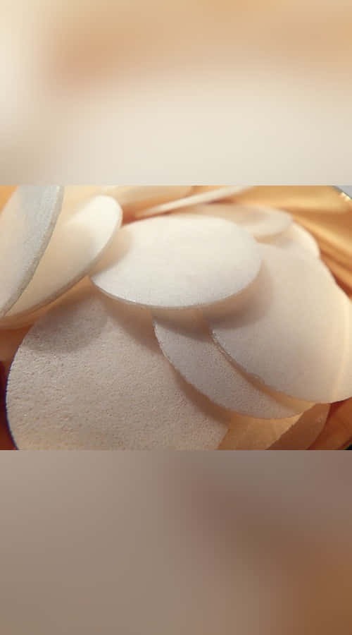 sacrament, white circular makeup sponges, warm golden light, SD Phone Wallpaper