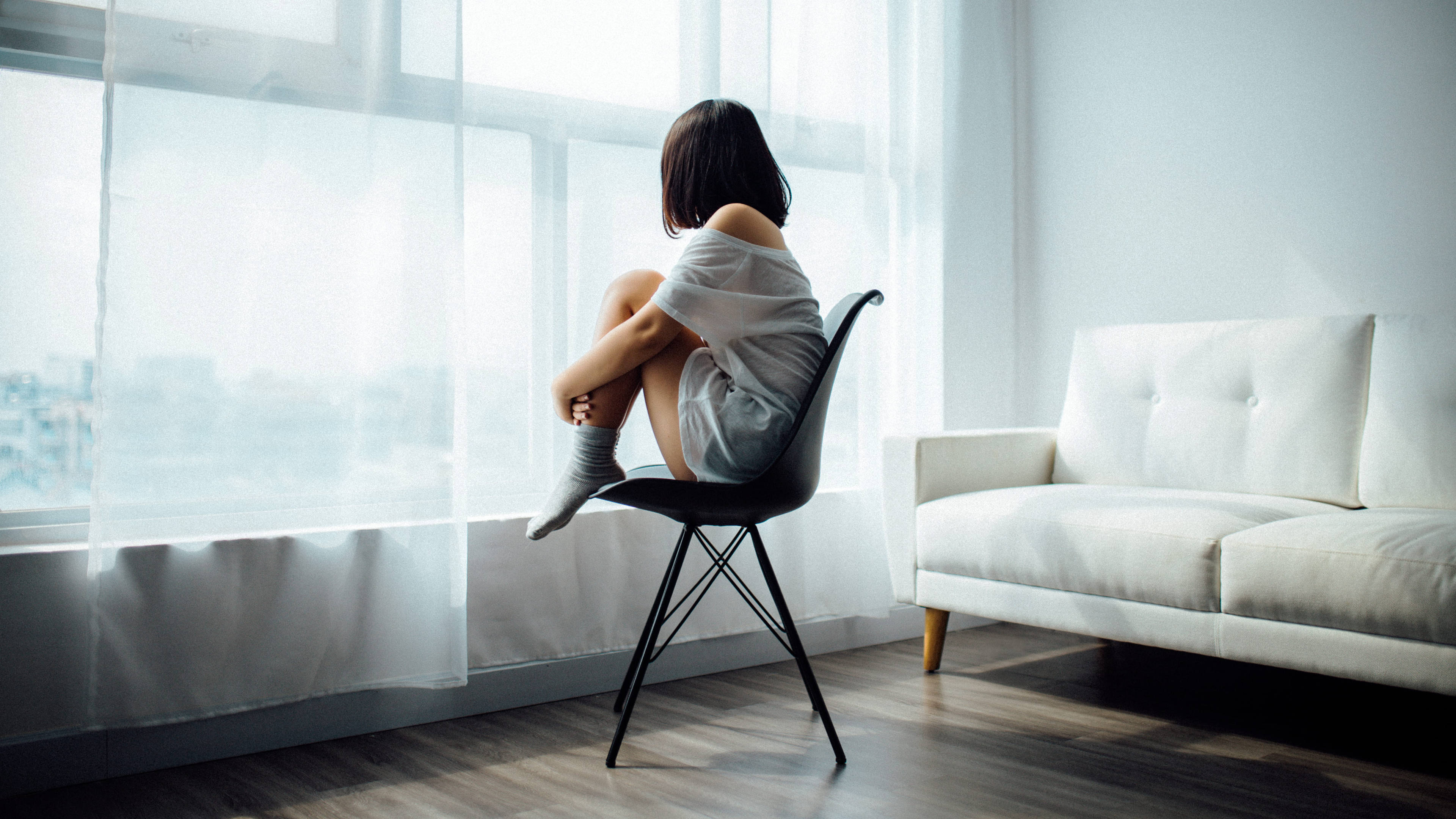 woman, black chair, bright window, 4K Desktop Wallpaper