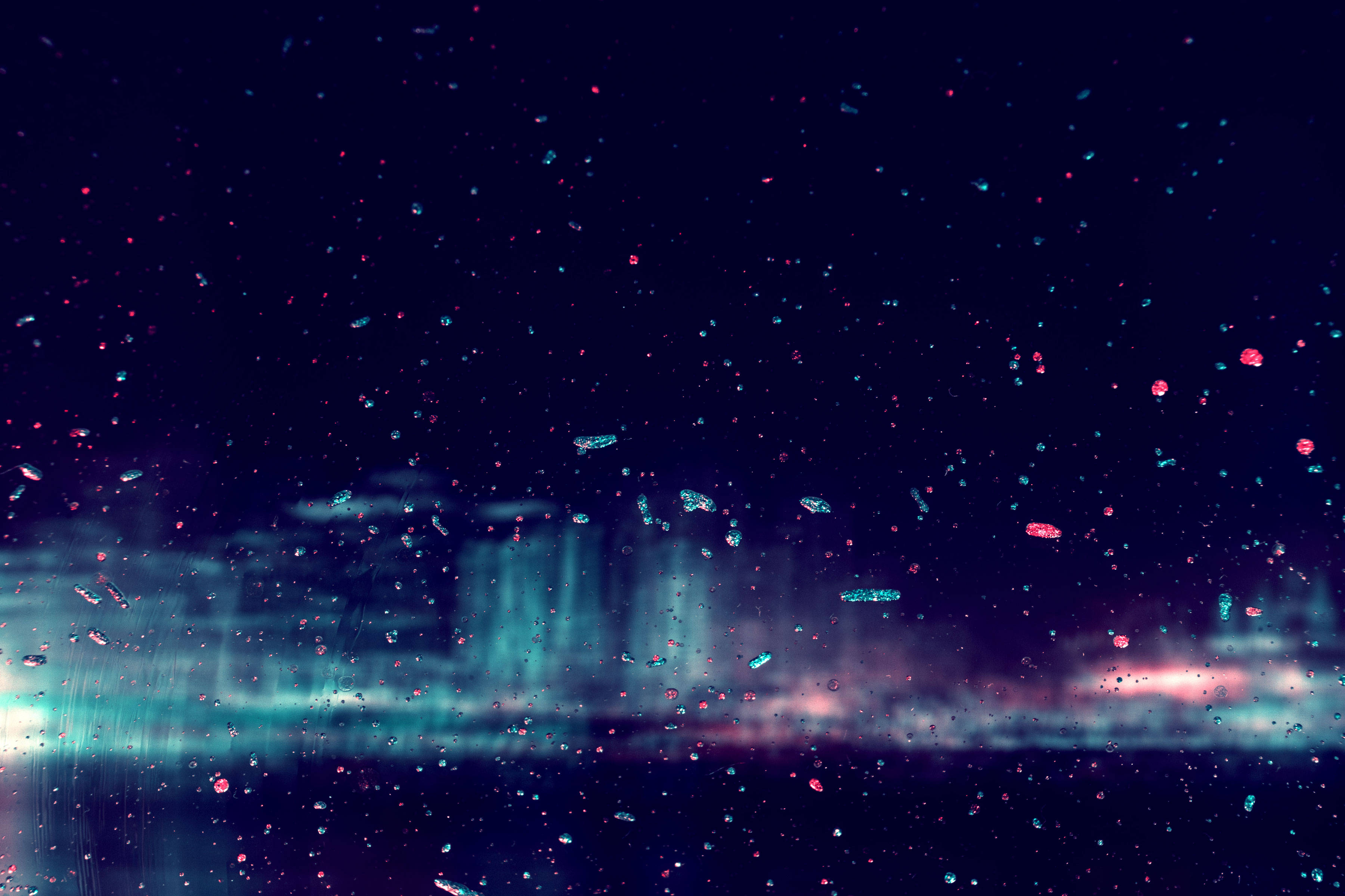 A dark window view of aurora borealis with raindrops glowing in neon blue and pink hues., 2K Desktop Wallpaper
