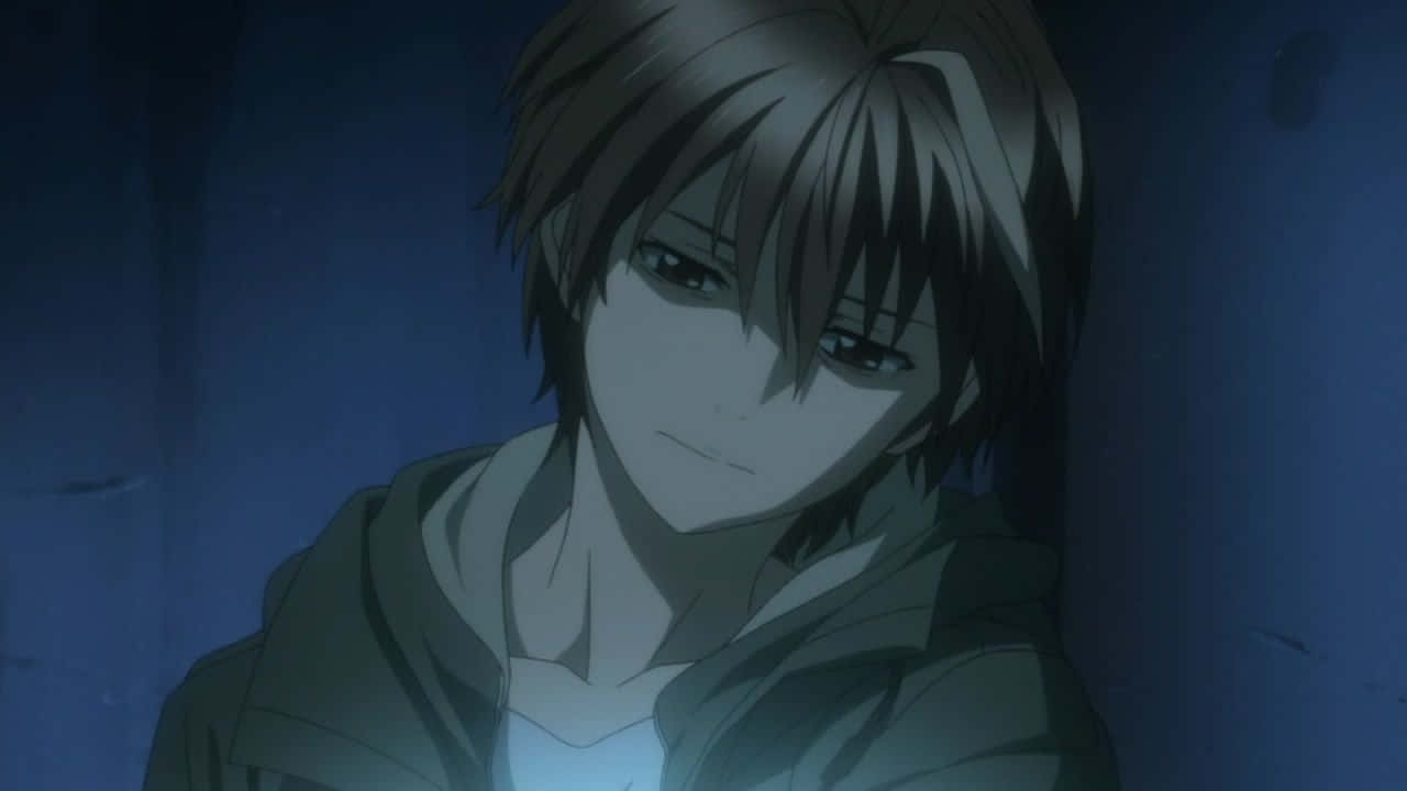 A melancholic anime boy with brown hair leans against a wall in dim blue lighting, eyes downcast with a subtle smile., HD Desktop Wallpaper