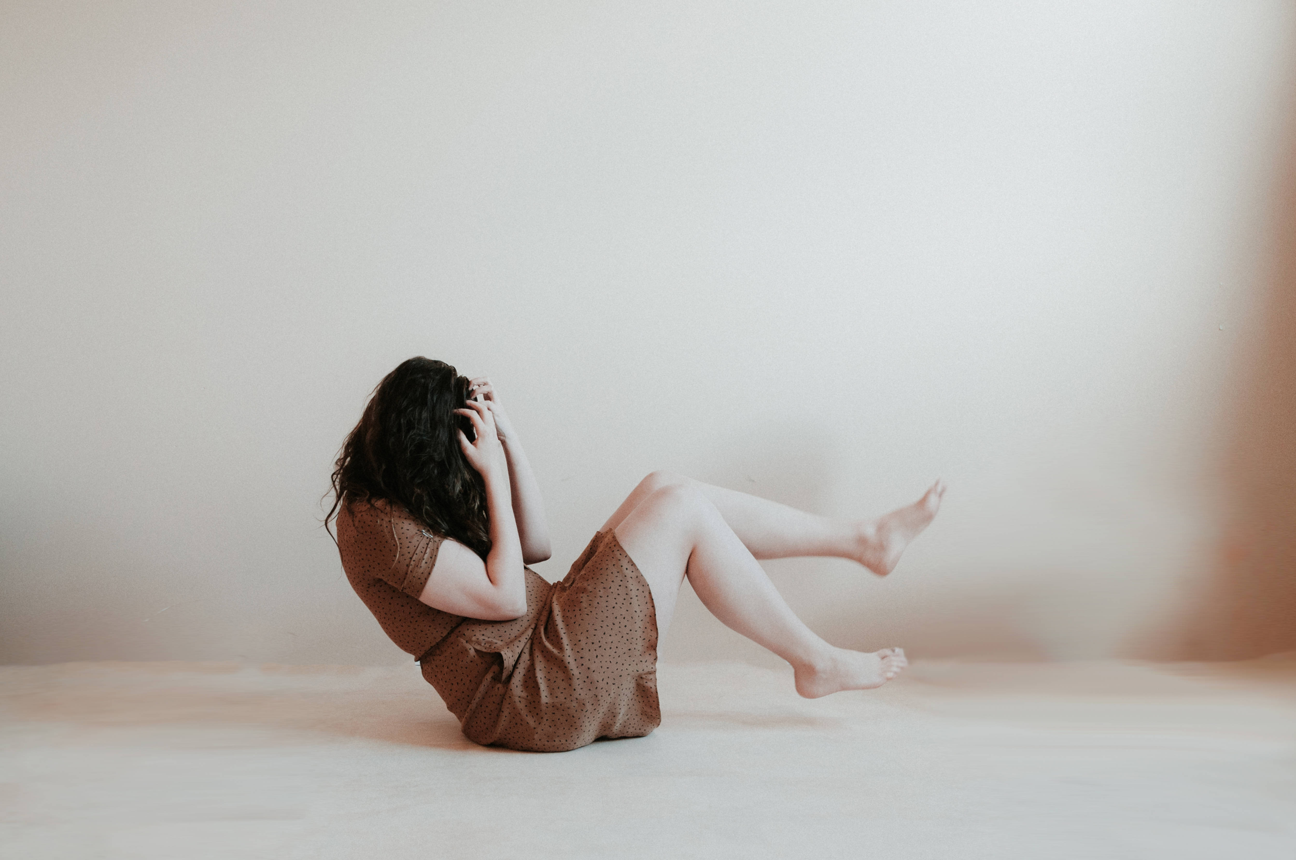 brown dress, light floor, plain wall, 4K Desktop Wallpaper