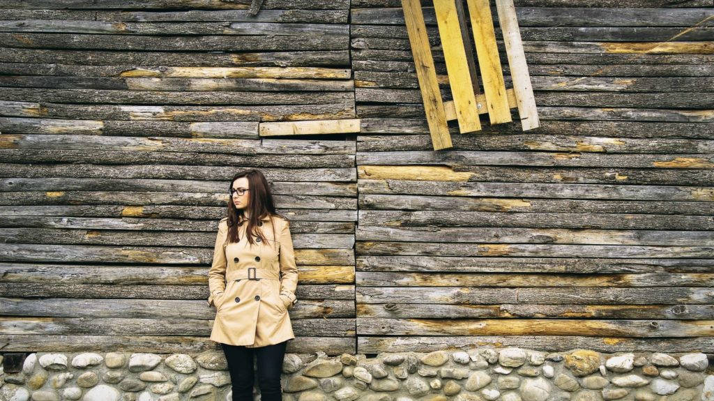 beige trench coat, weathered wooden wall, stone base, SD Desktop Wallpaper
