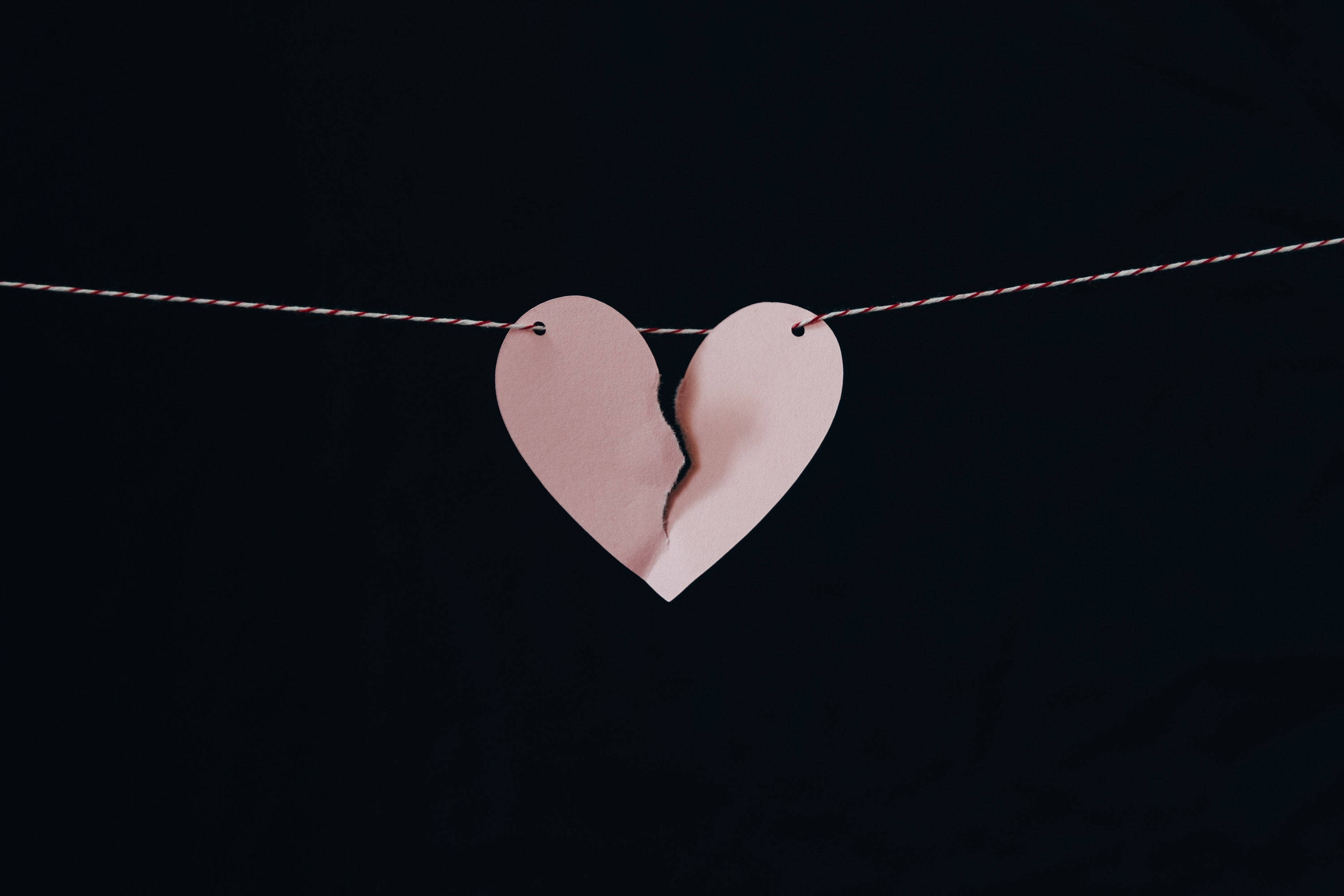 torn pink paper heart, red and white string, dark background, 2K Desktop Wallpaper