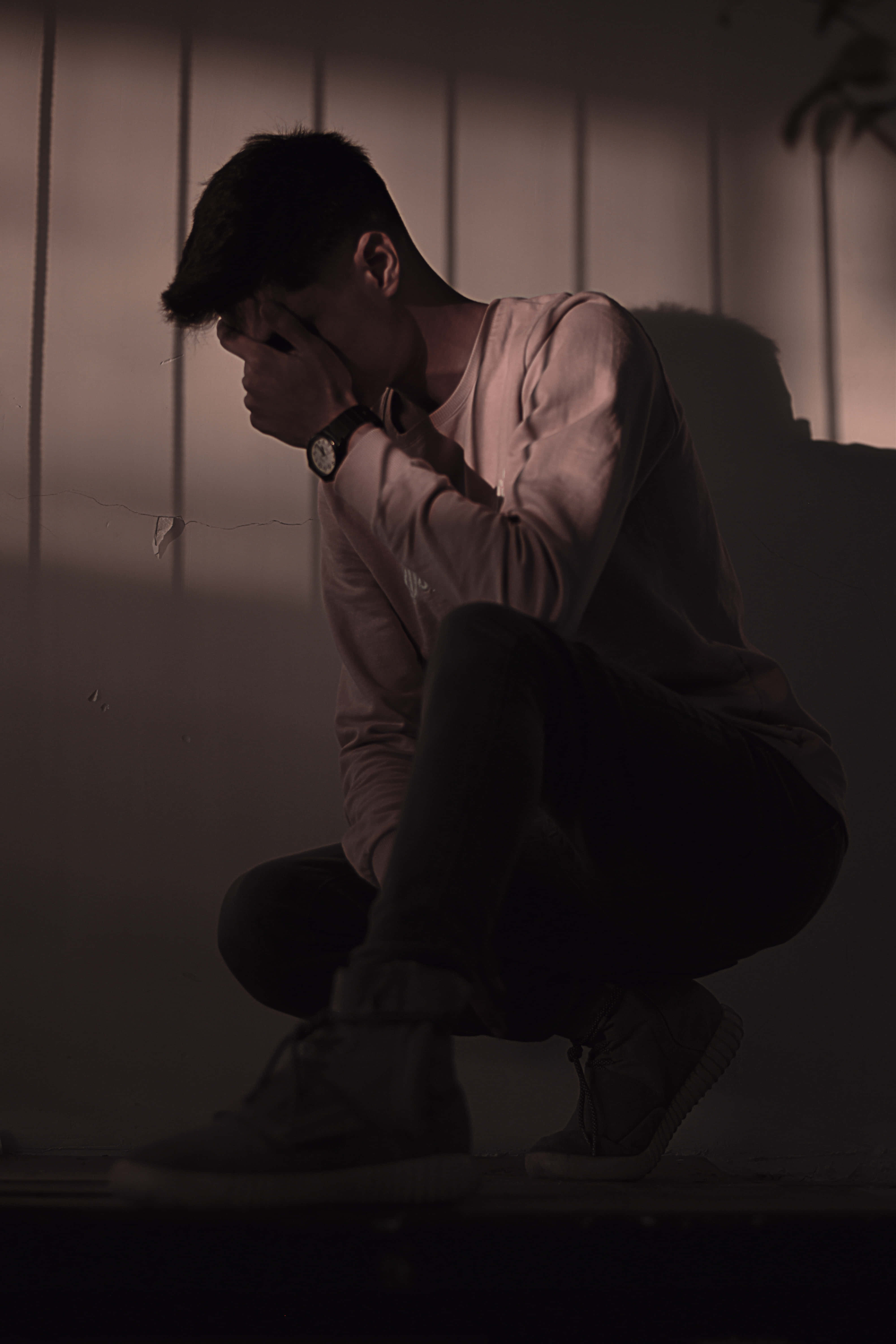 young man, dim light, paneled wall, 5K Phone Wallpaper