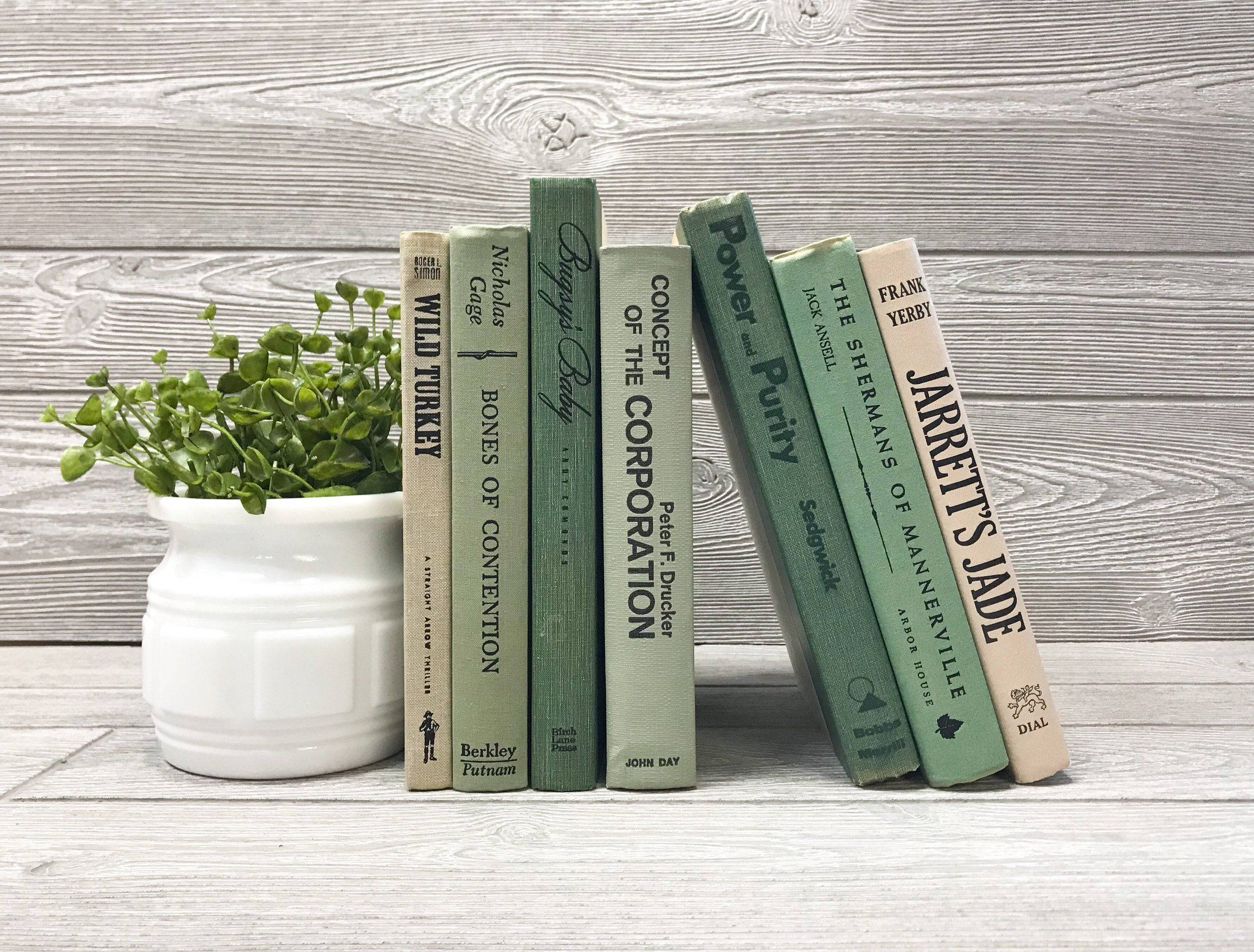 sage green, vintage books, weathered wooden backdrop, 2K Desktop Wallpaper