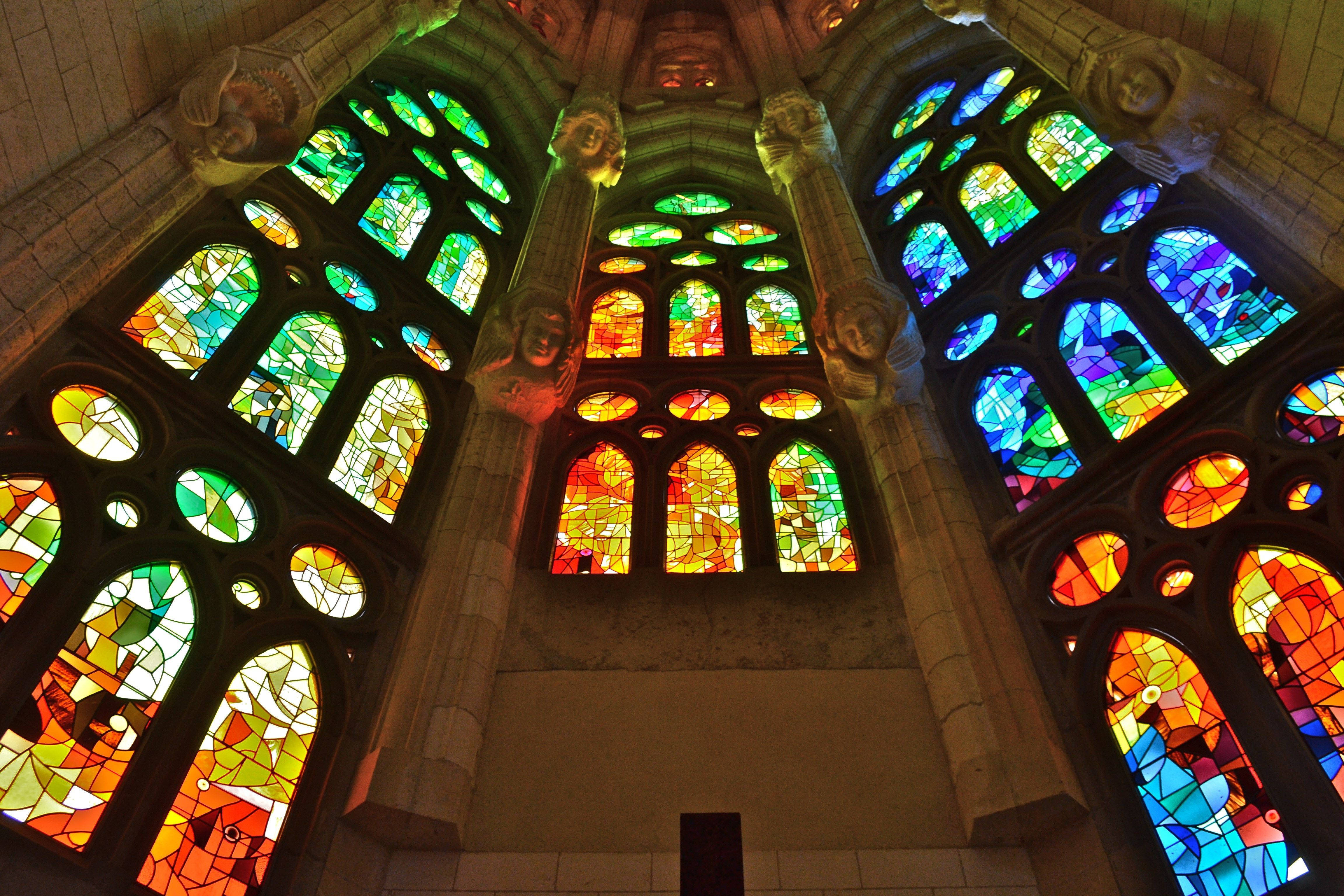 Sagrada Familia, stained glass windows, arched stone frames, 4K Desktop Wallpaper