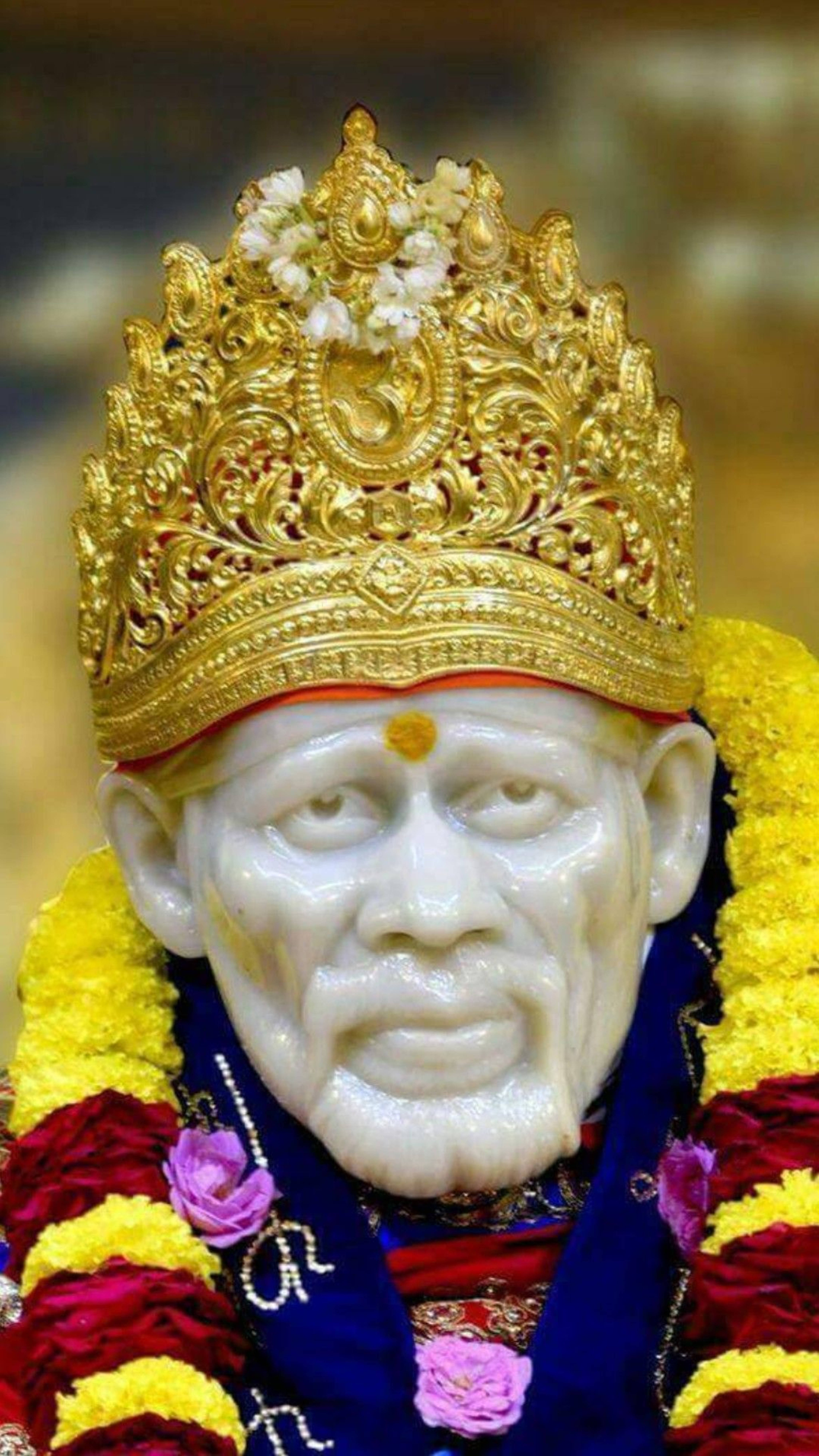 Sai Baba, white marble statue, golden crown, 8K Phone Wallpaper