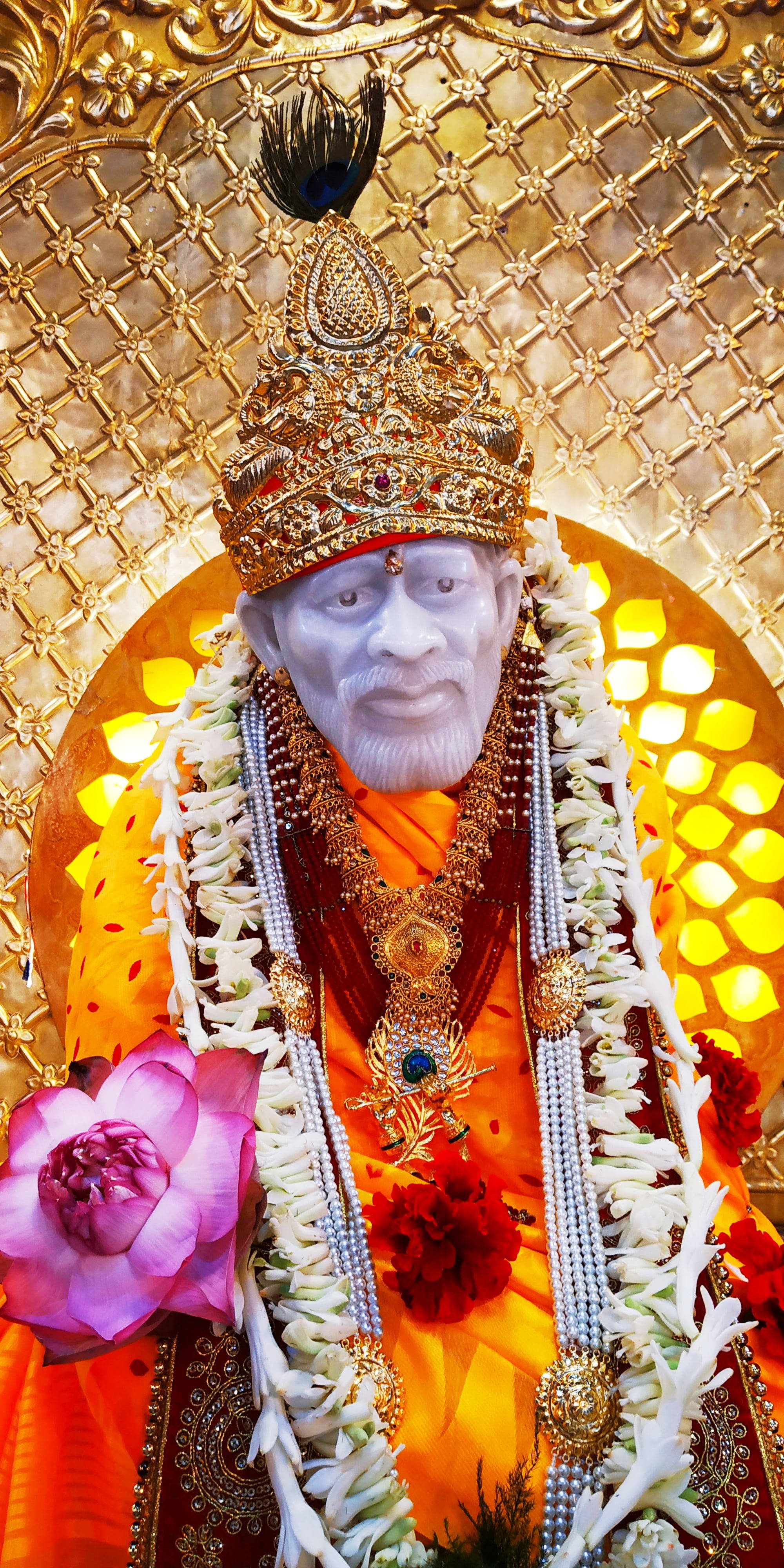 Sai Baba, golden crown jewels, white flower garlands, 4K Phone Wallpaper