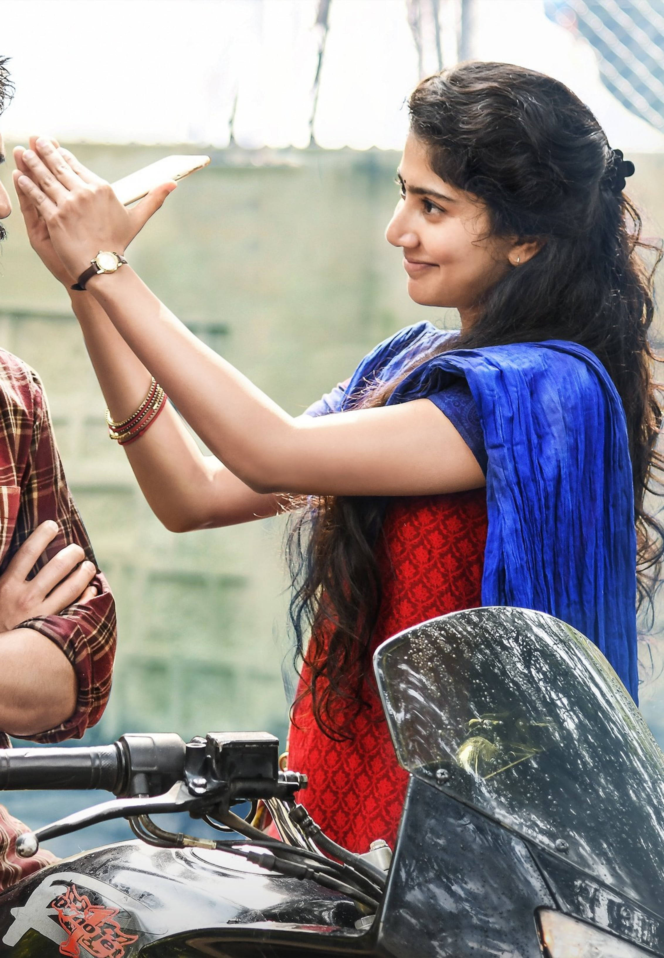 Sai Pallavi, red and blue traditional attire, motorcycle, 2K Phone Wallpaper