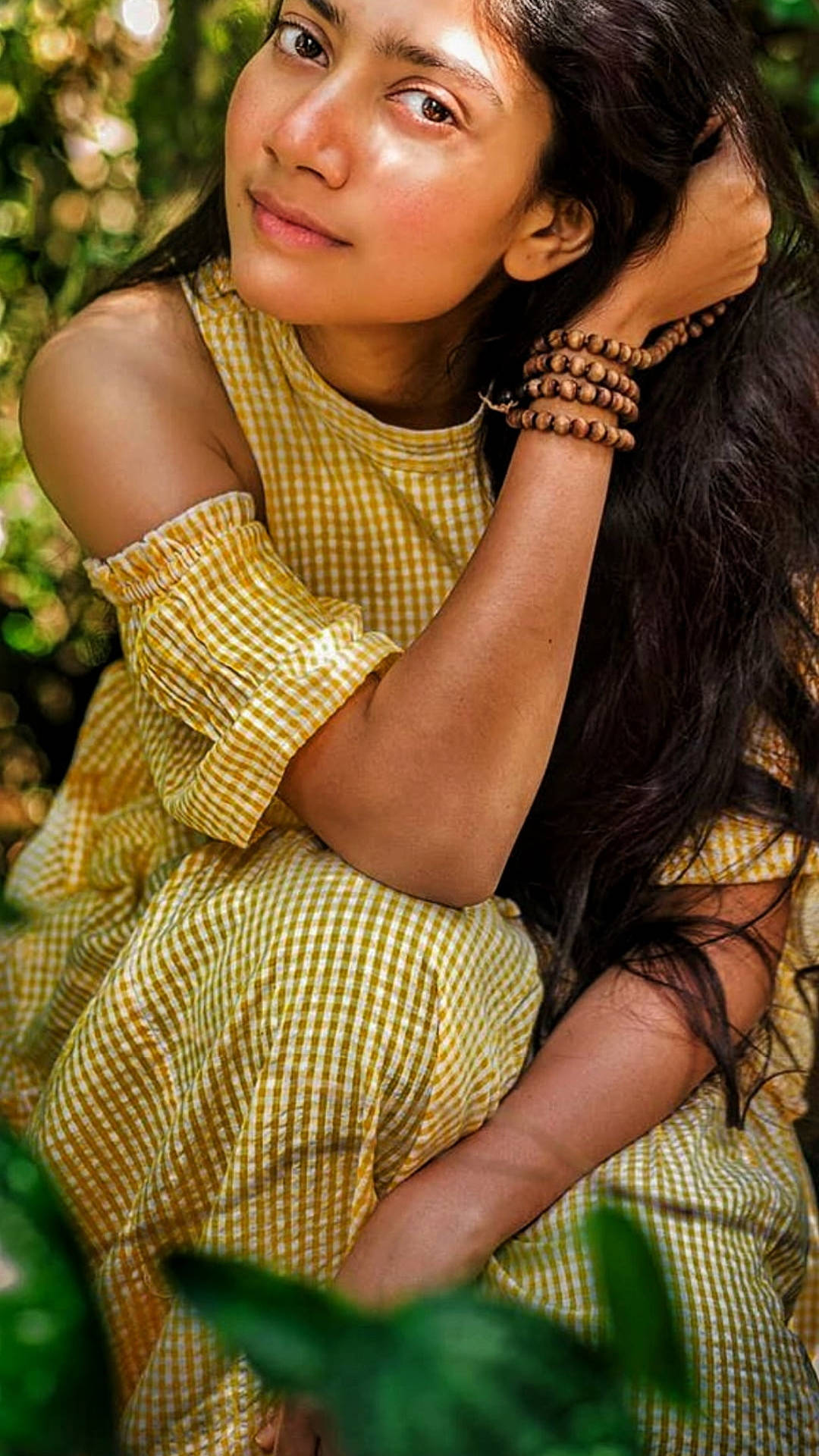 Sai Pallavi, yellow gingham dress, lush green foliage, Full HD Phone Wallpaper
