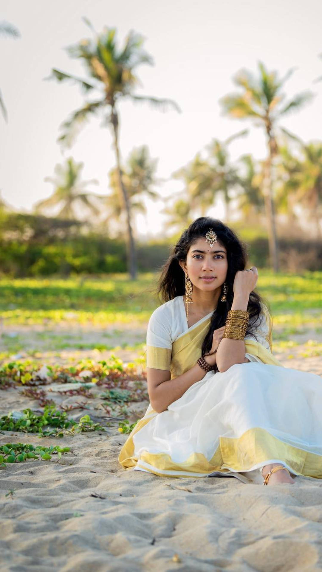 Sai Pallavi, white and yellow traditional attire, sandy beach, Full HD Phone Wallpaper