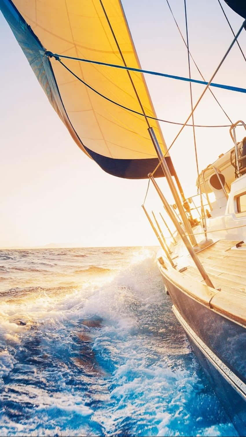 sailboat, vibrant yellow sail, sparkling blue ocean, HD Phone Wallpaper