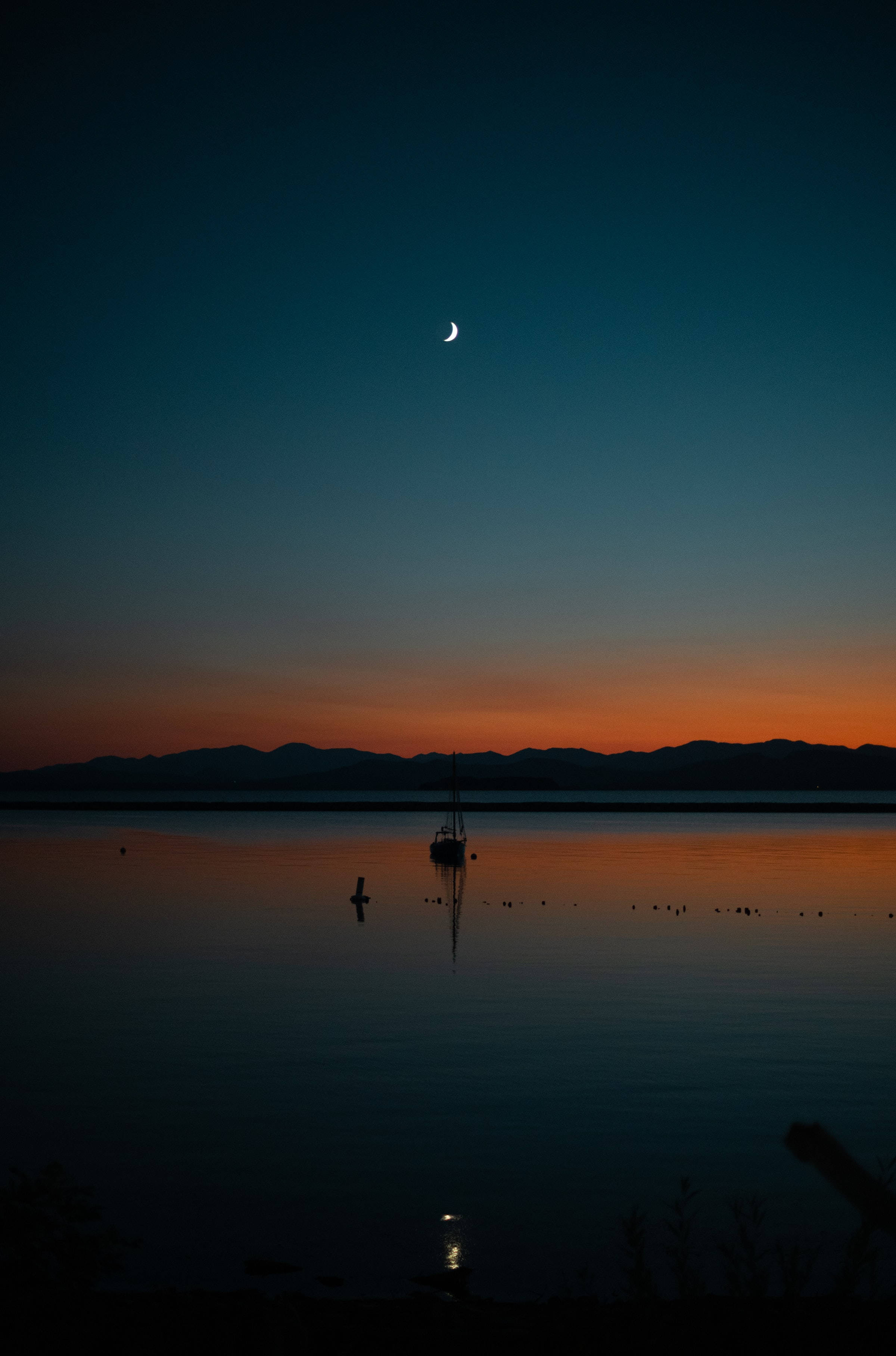 half crescent moon, calm lake, distant mountains, 2K Phone Wallpaper
