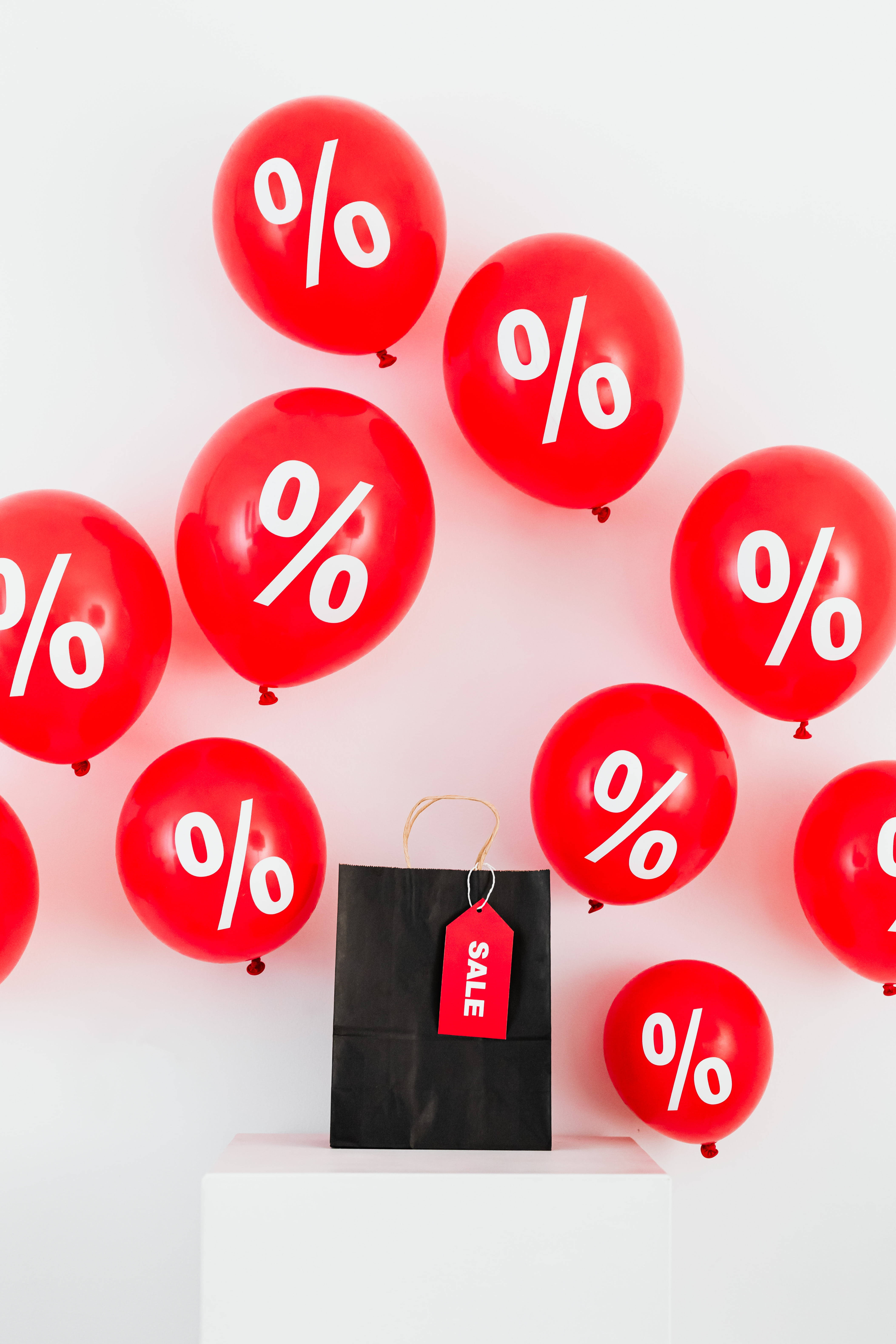 red sales tag, black shopping bag, white percentage symbols, 5K Phone Wallpaper