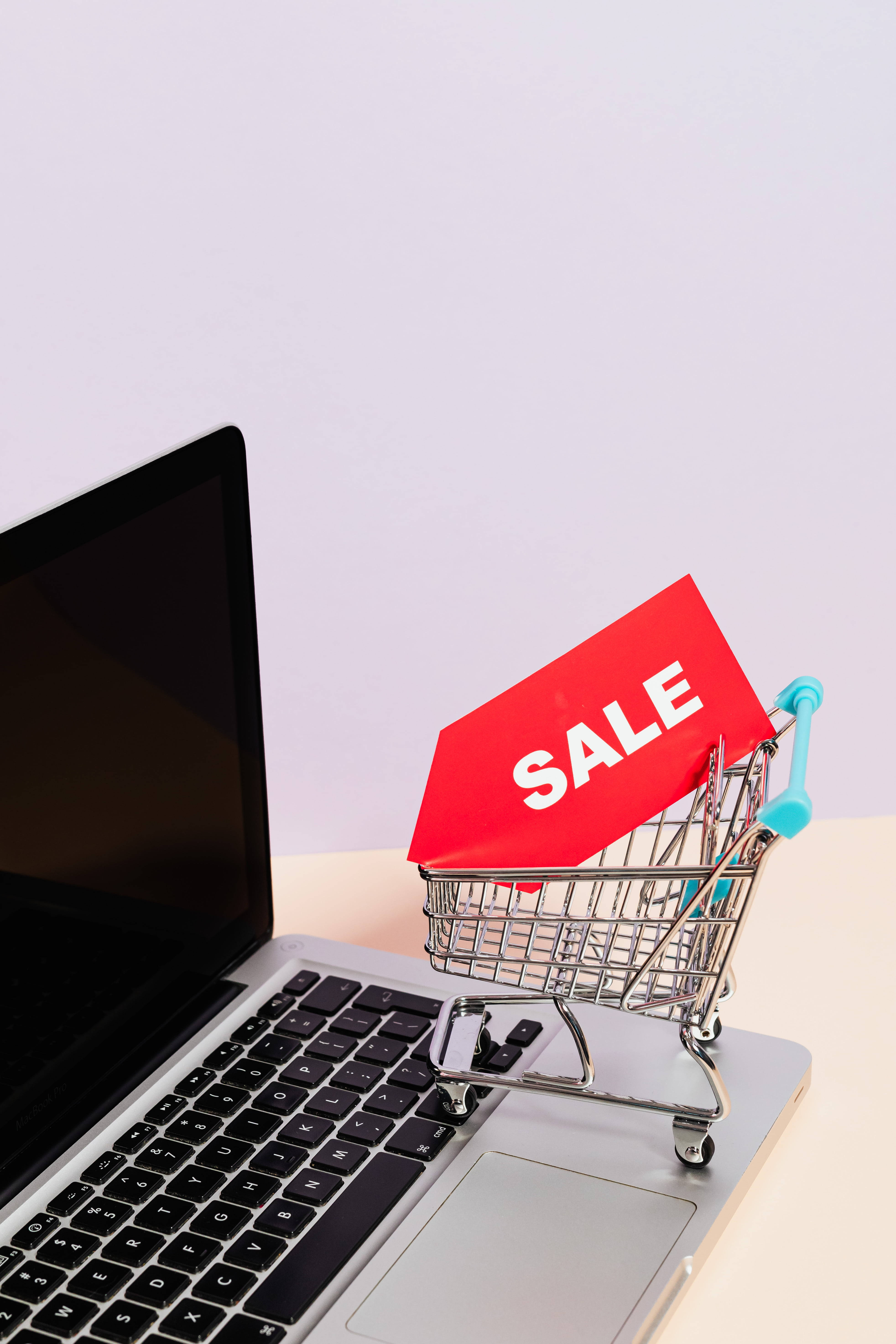 sales miniature shopping cart, red sale sign, laptop keyboard, 5K Phone Wallpaper