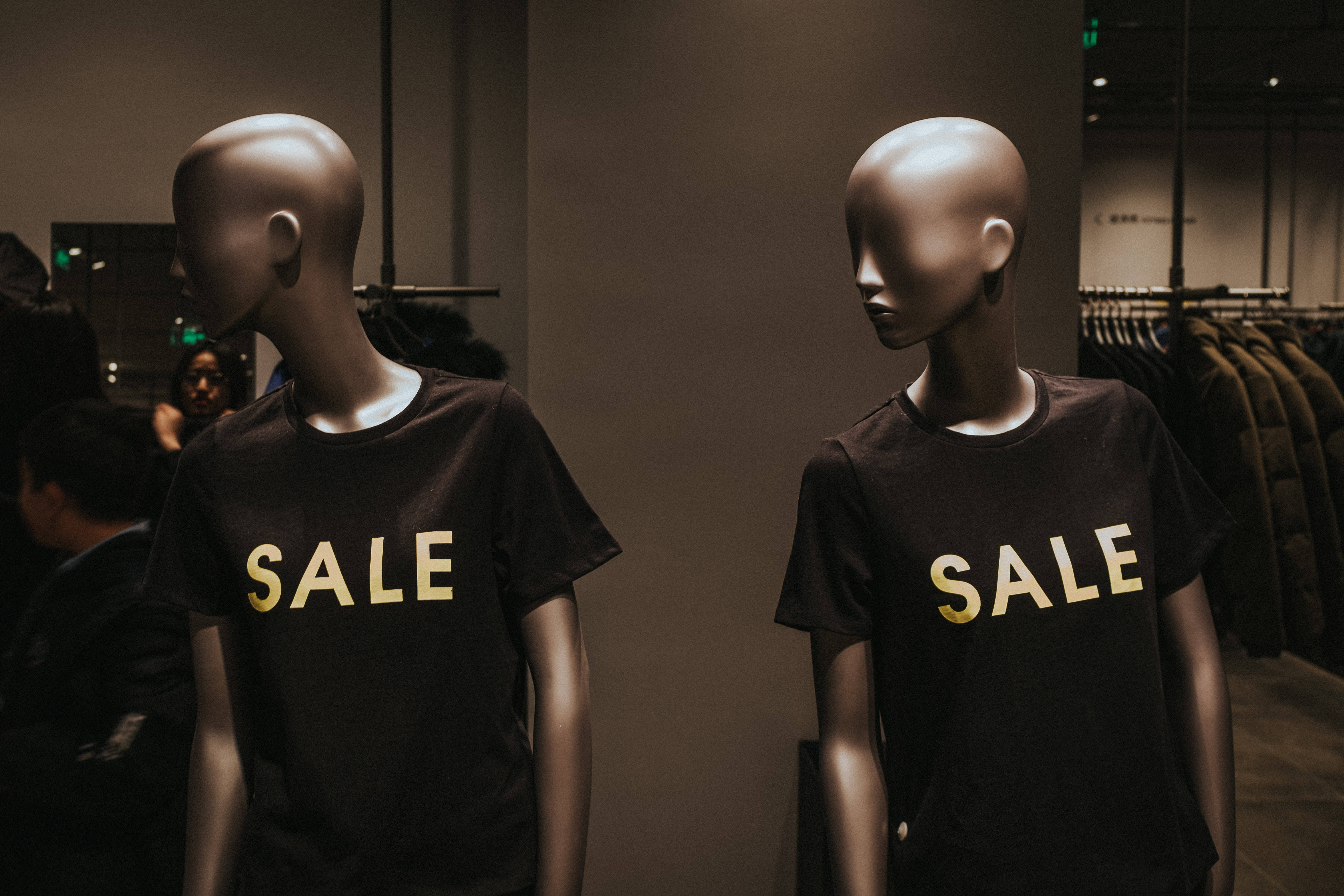 Sales Two Mannequin Models, black t-shirts, bold gold 'SALE' text, 5K Desktop Wallpaper