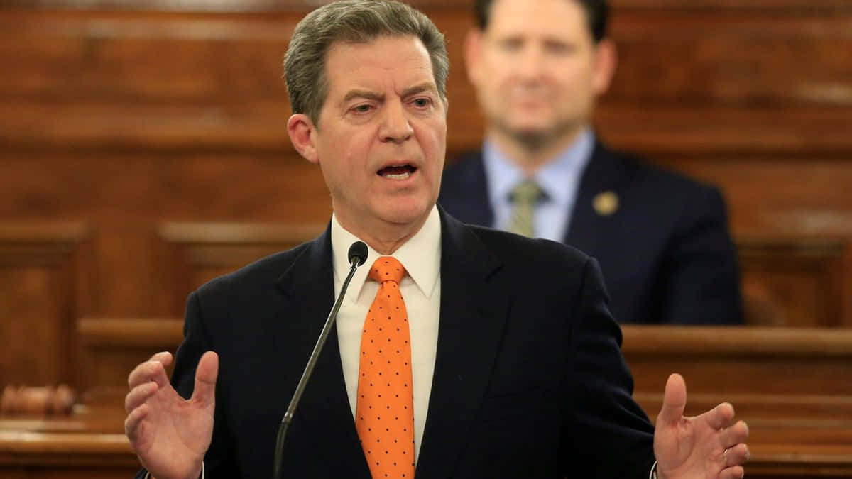 Sam Brownback, dark suit, orange polka-dot tie, SD Desktop Wallpaper