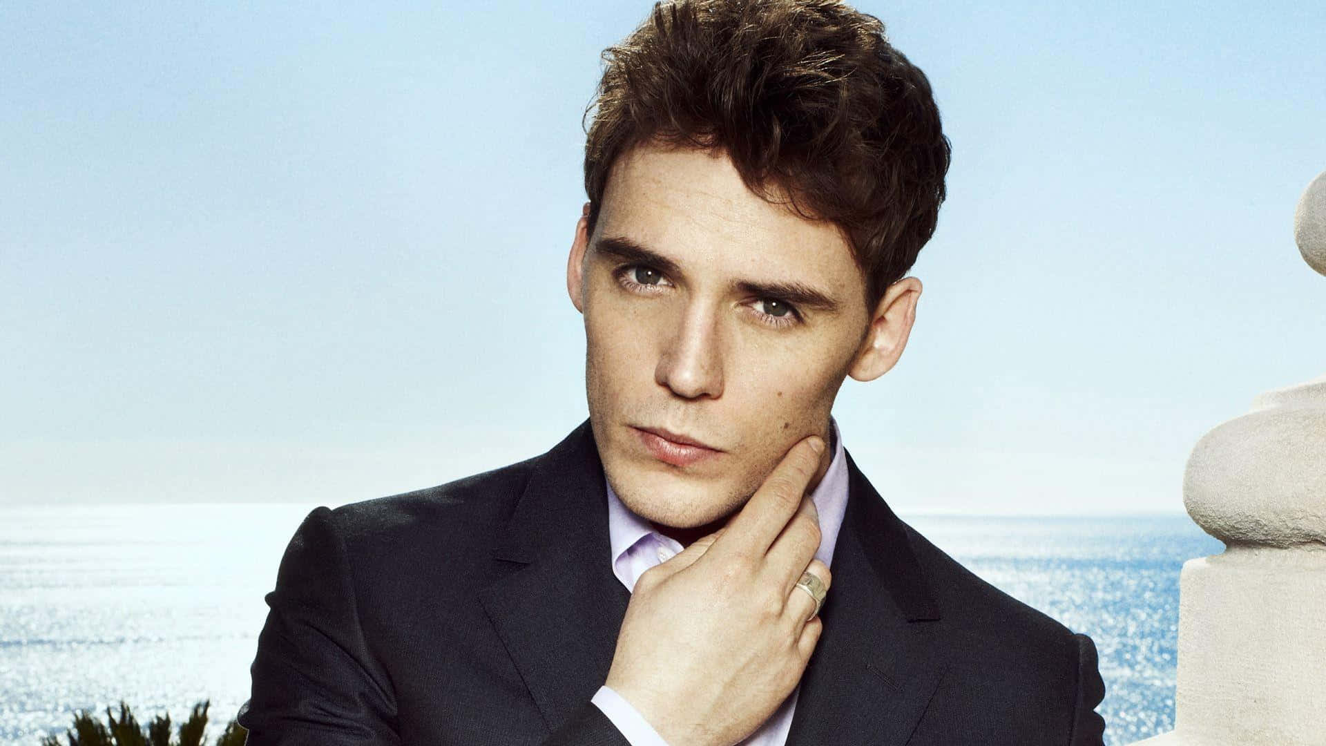 Sam Claflin, dark suit, seaside backdrop, Full HD Desktop Wallpaper
