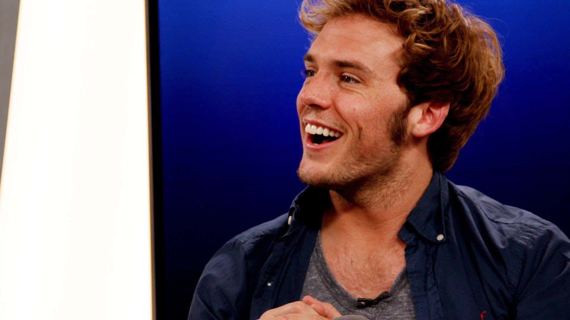 Sam Claflin, curly hair, blue and white backdrop, Full HD Desktop Wallpaper