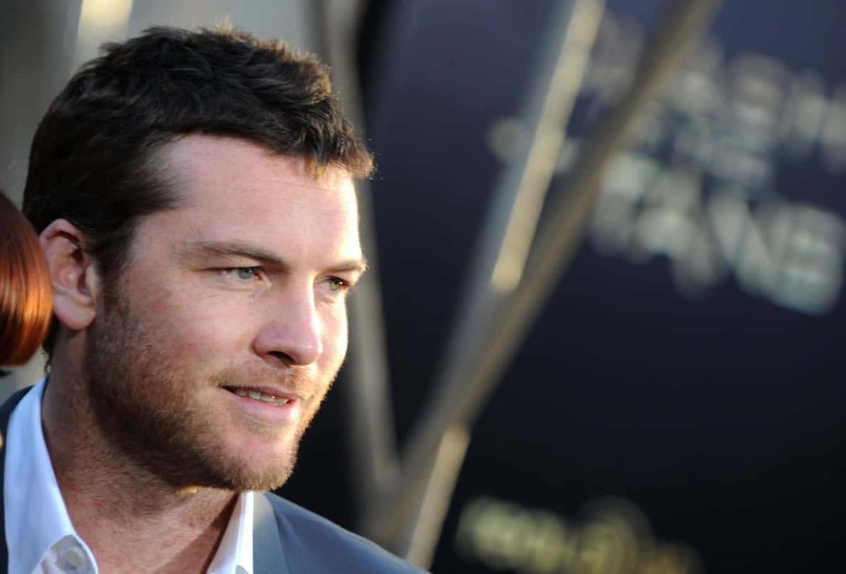 Sam Worthington, side profile, smile, SD Desktop Wallpaper