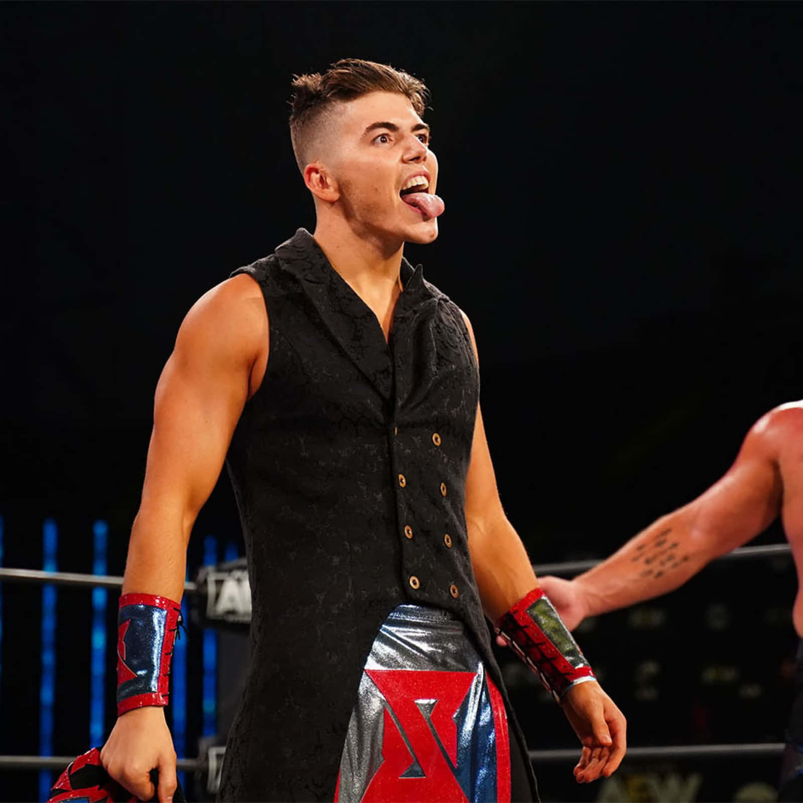 Sammy Guevara, black vest, shiny red blue trunks, HD Desktop Wallpaper