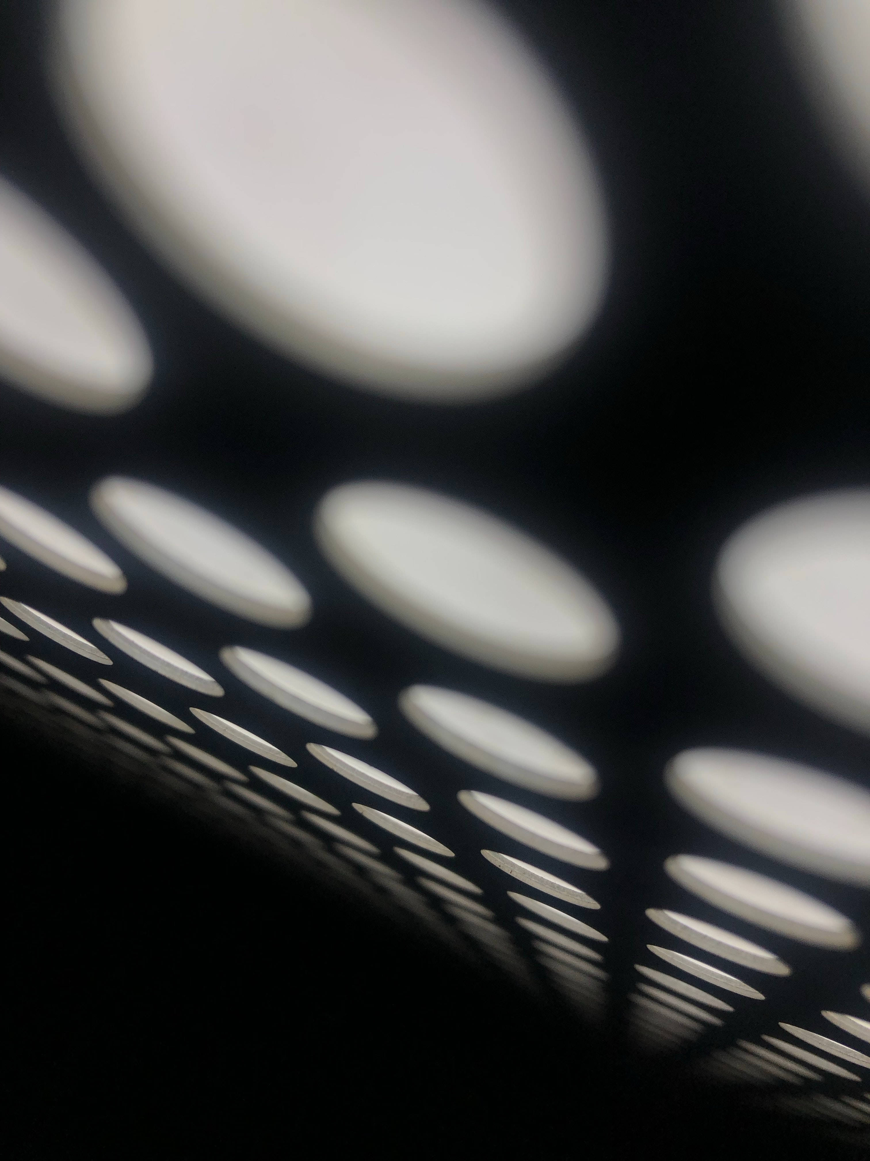Samsung Black, black perforated surface, glowing white circular holes, 4K Phone Wallpaper