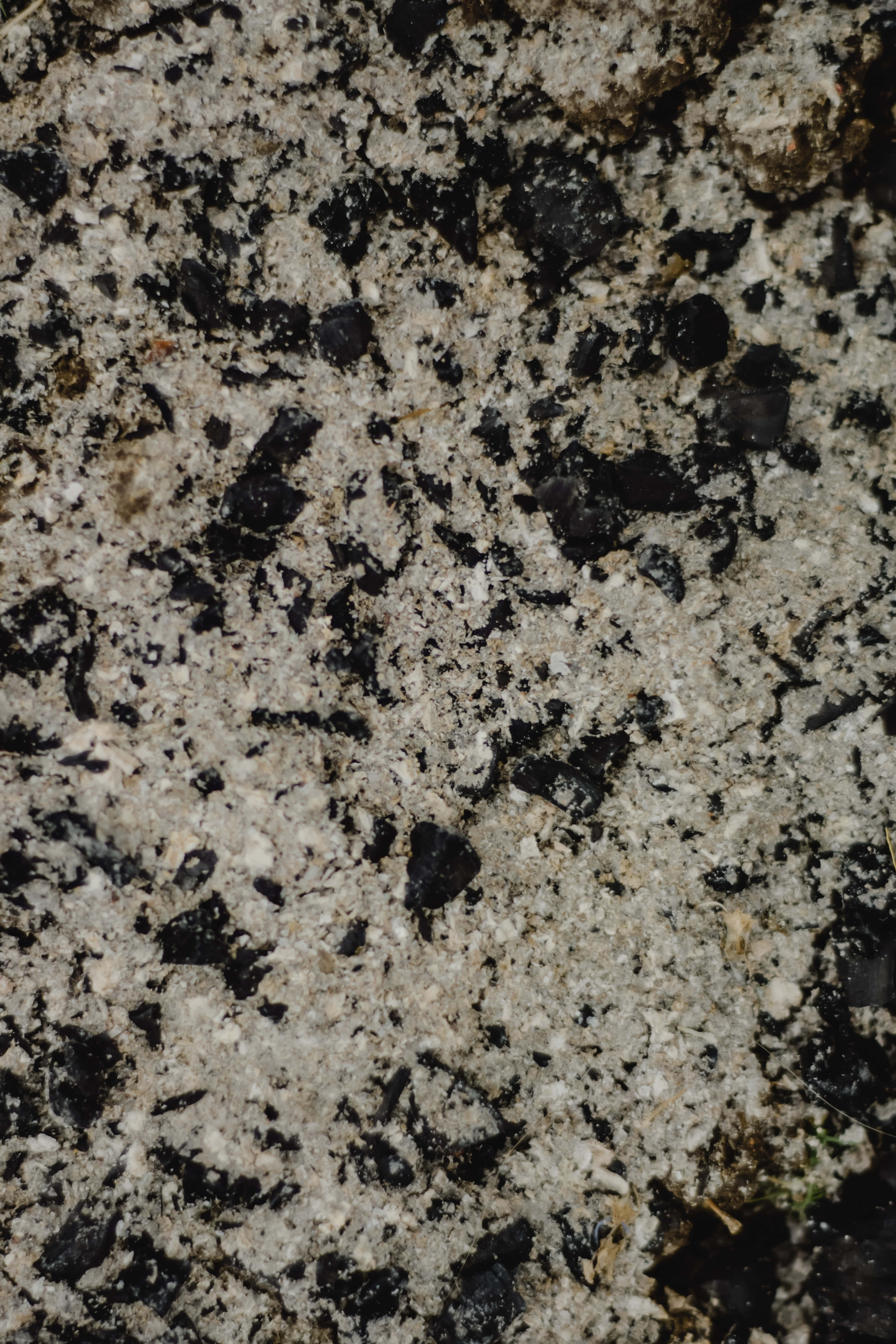 gritty sand, rough textured granite, black and white mineral grains, 5K Phone Wallpaper