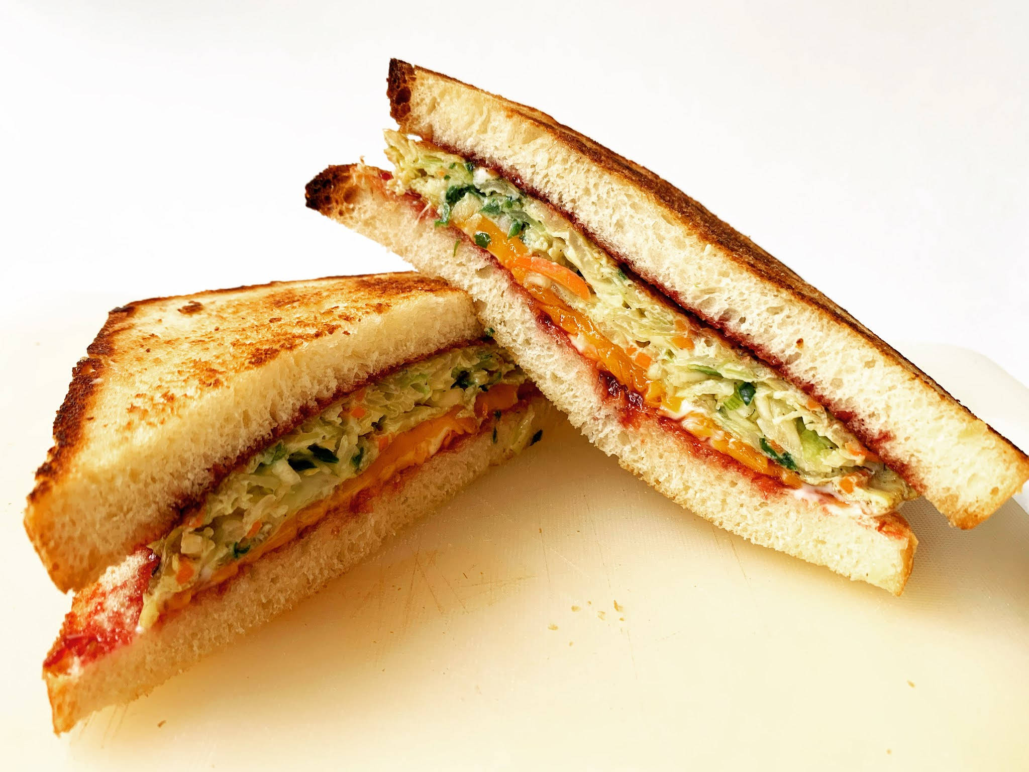 breakfast sandwiches, golden toasted sandwich halves, vibrant coleslaw, Full HD Desktop Wallpaper