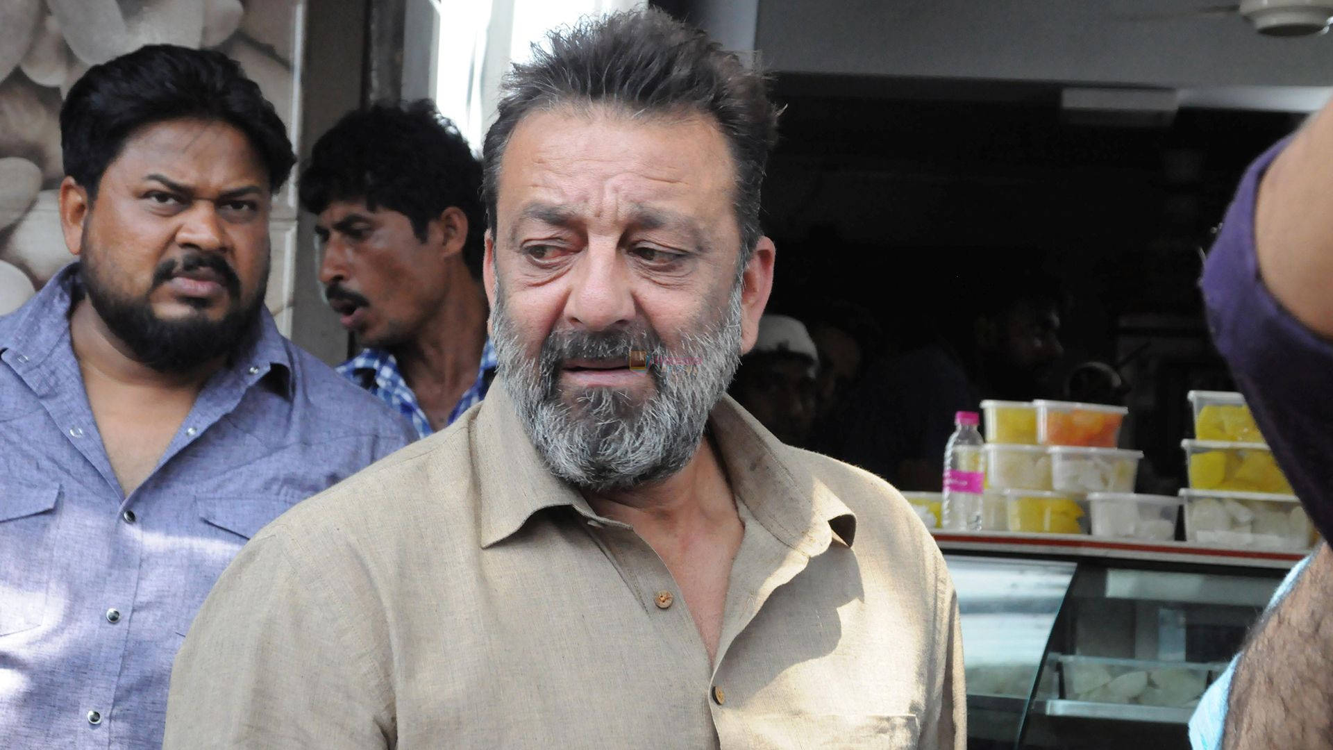 Sanjay Dutt, graying beard, bustling street food stall, Full HD Desktop Wallpaper