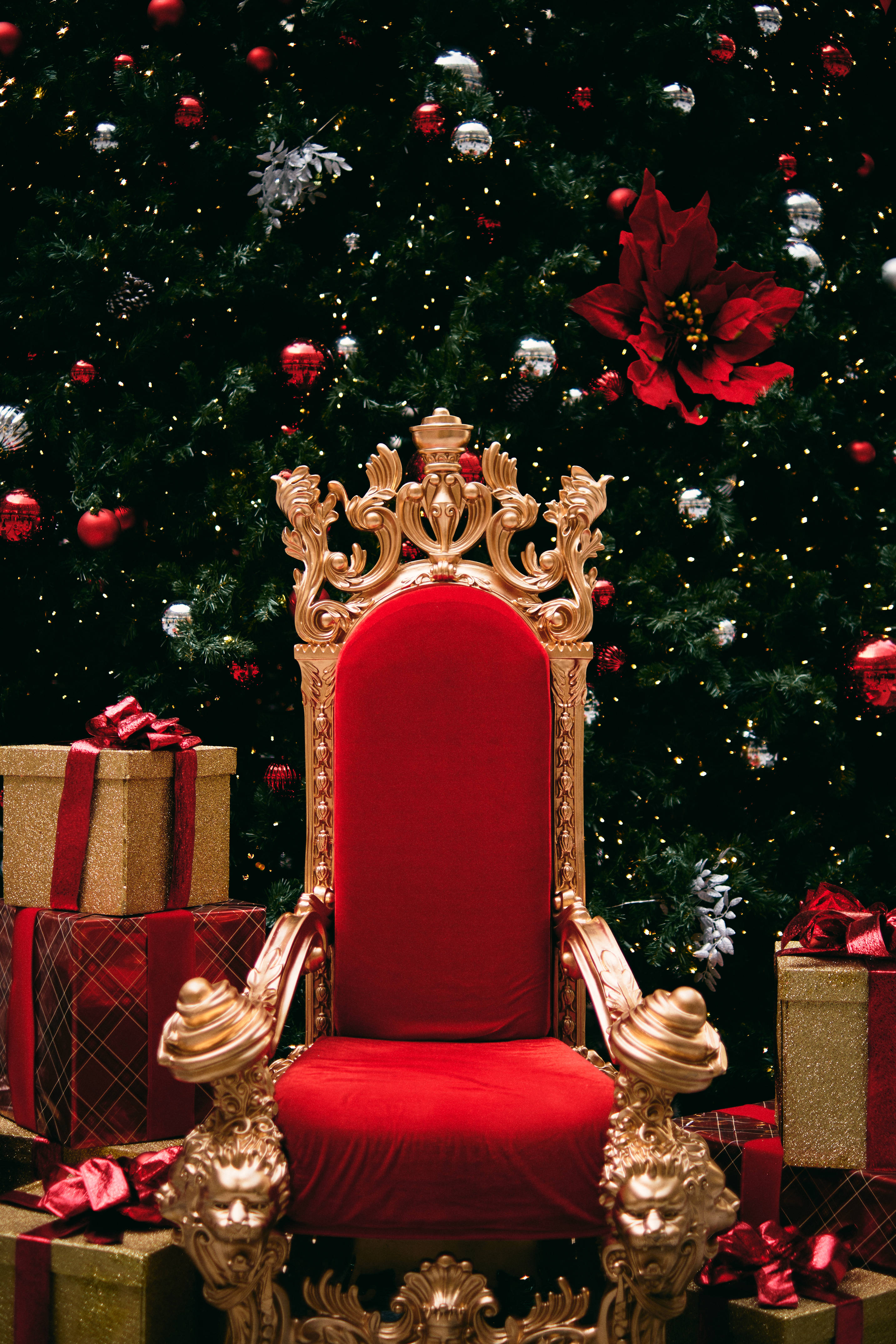 red velvet throne, gold ornate carvings, lush Christmas tree, 4K Phone Wallpaper