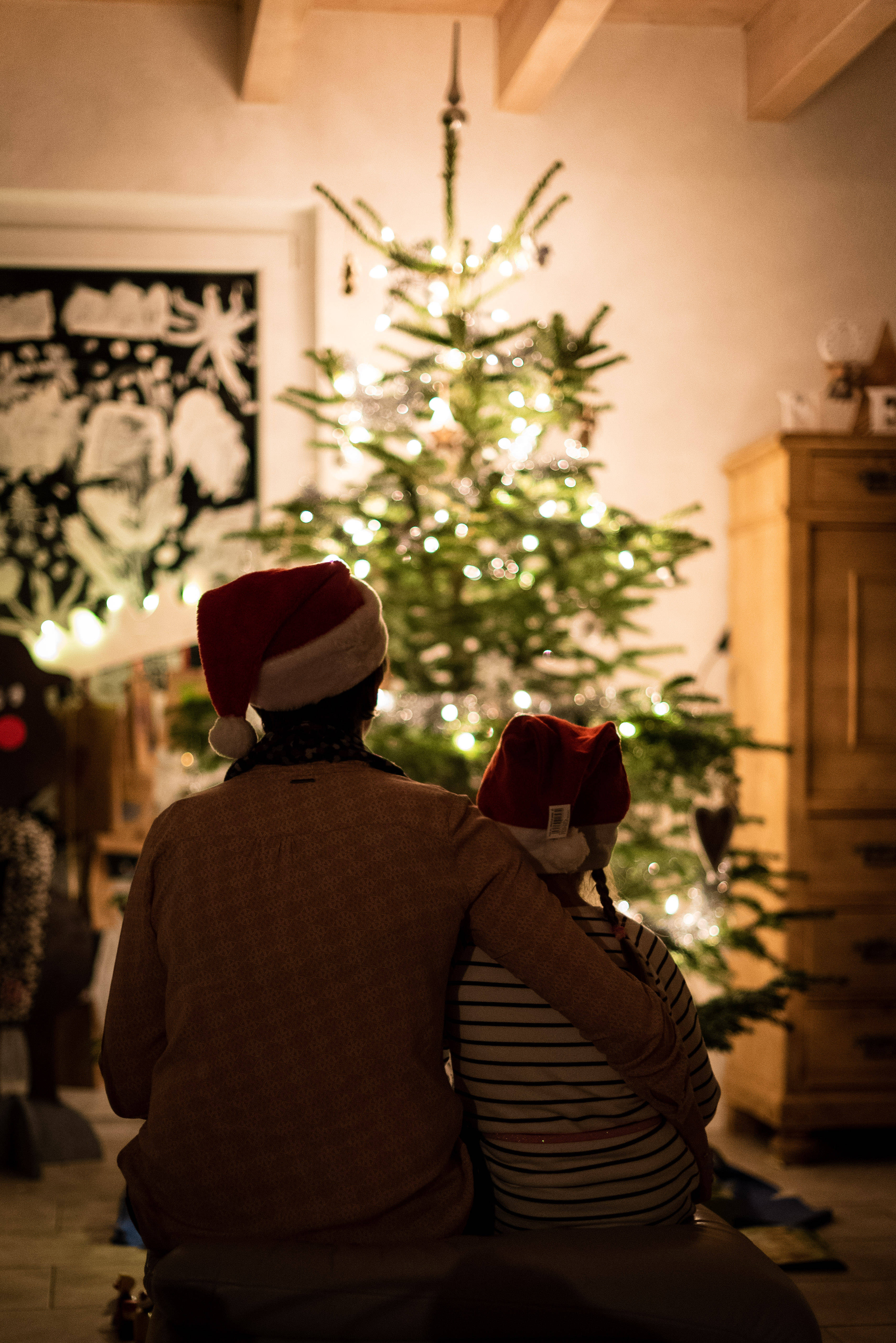 Santa hats, Christmas tree, cozy home, 4K Phone Wallpaper