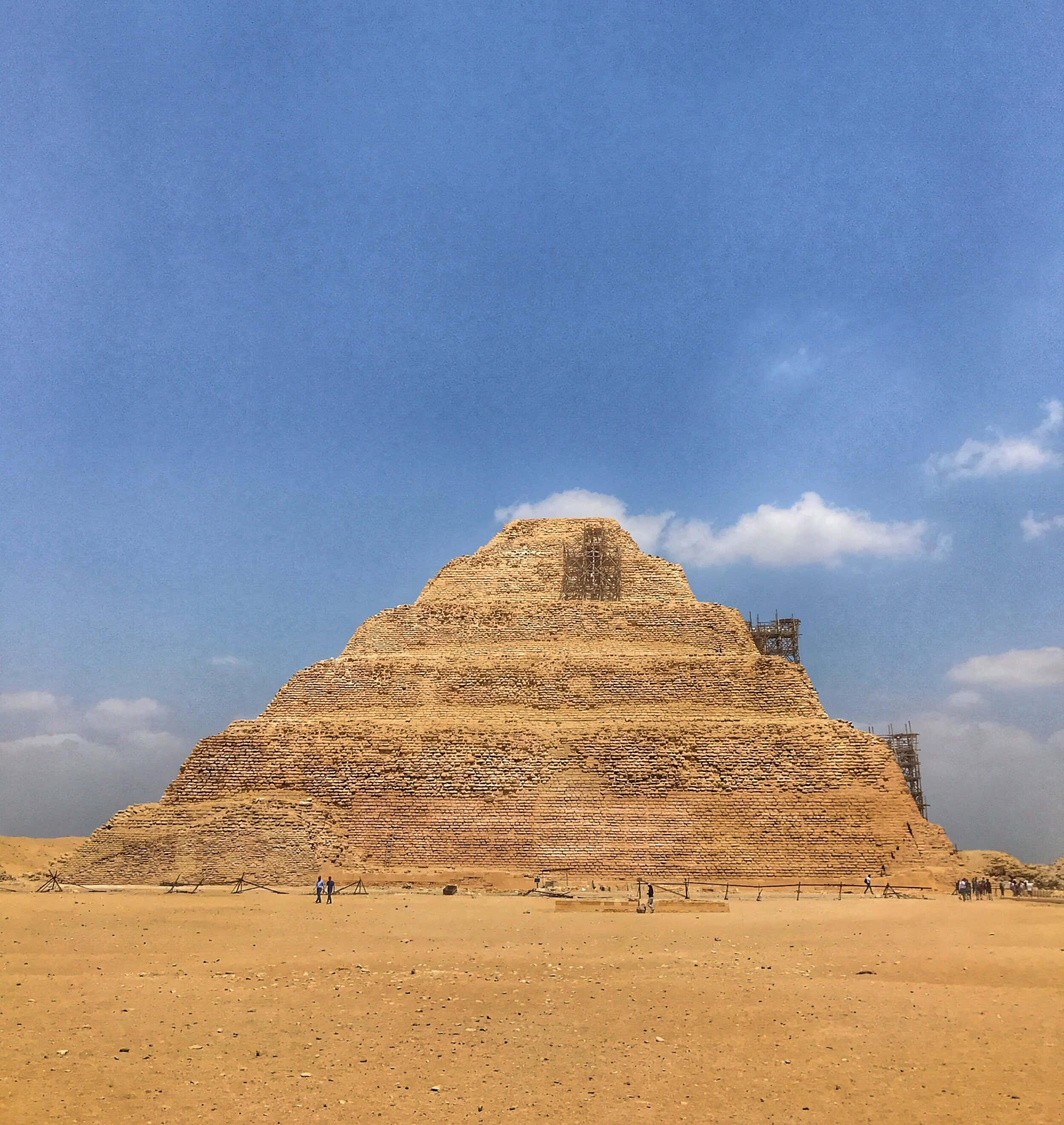Saqqara Pyramid, golden desert sands, vast blue sky, 2K Phone Wallpaper