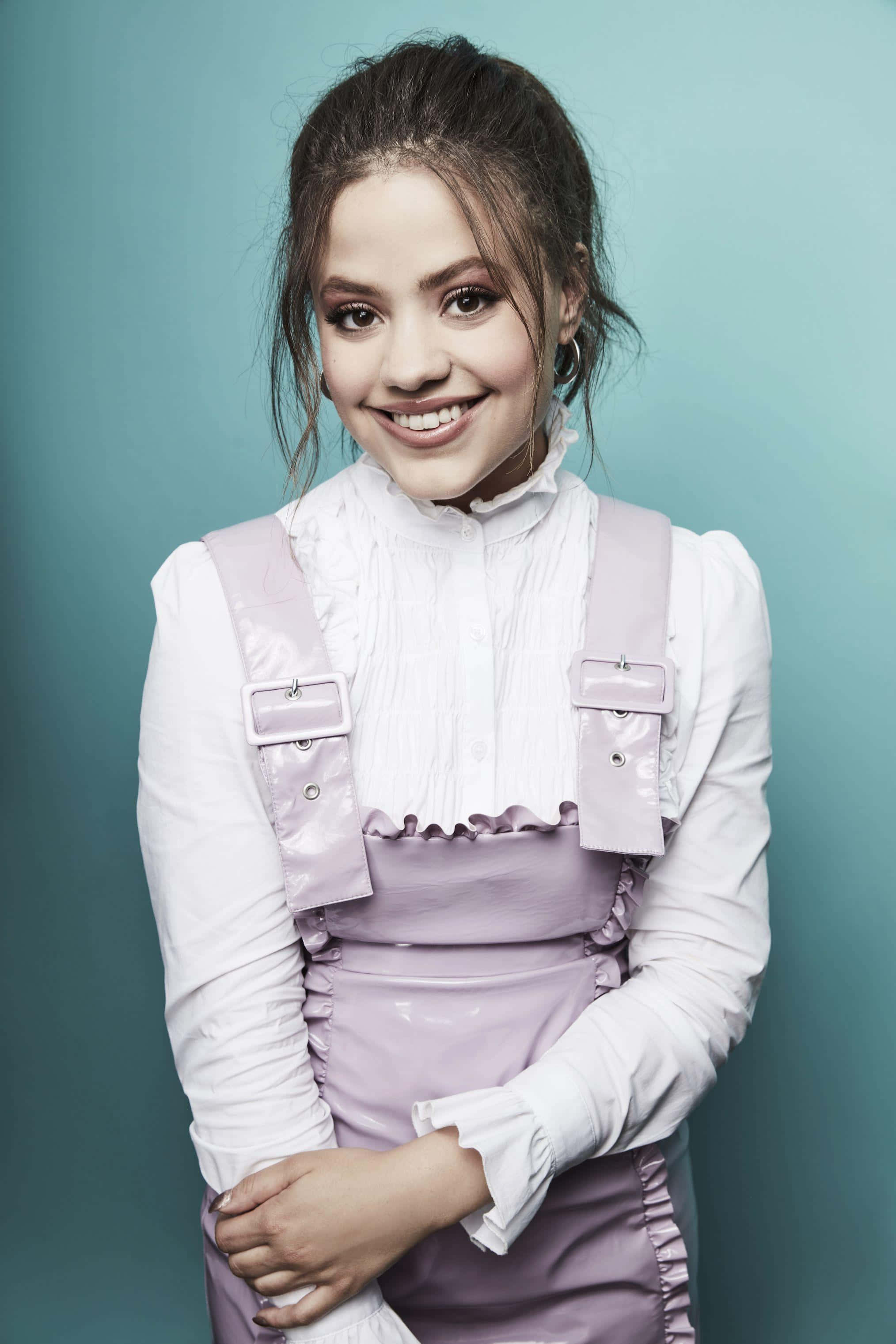Sarah Jeffery, white blouse, shiny lavender overalls, 2K Phone Wallpaper