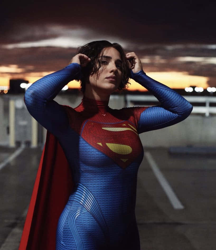 Sasha Calle Supergirl, textured blue and red suit, flowing cape, SD Phone Wallpaper