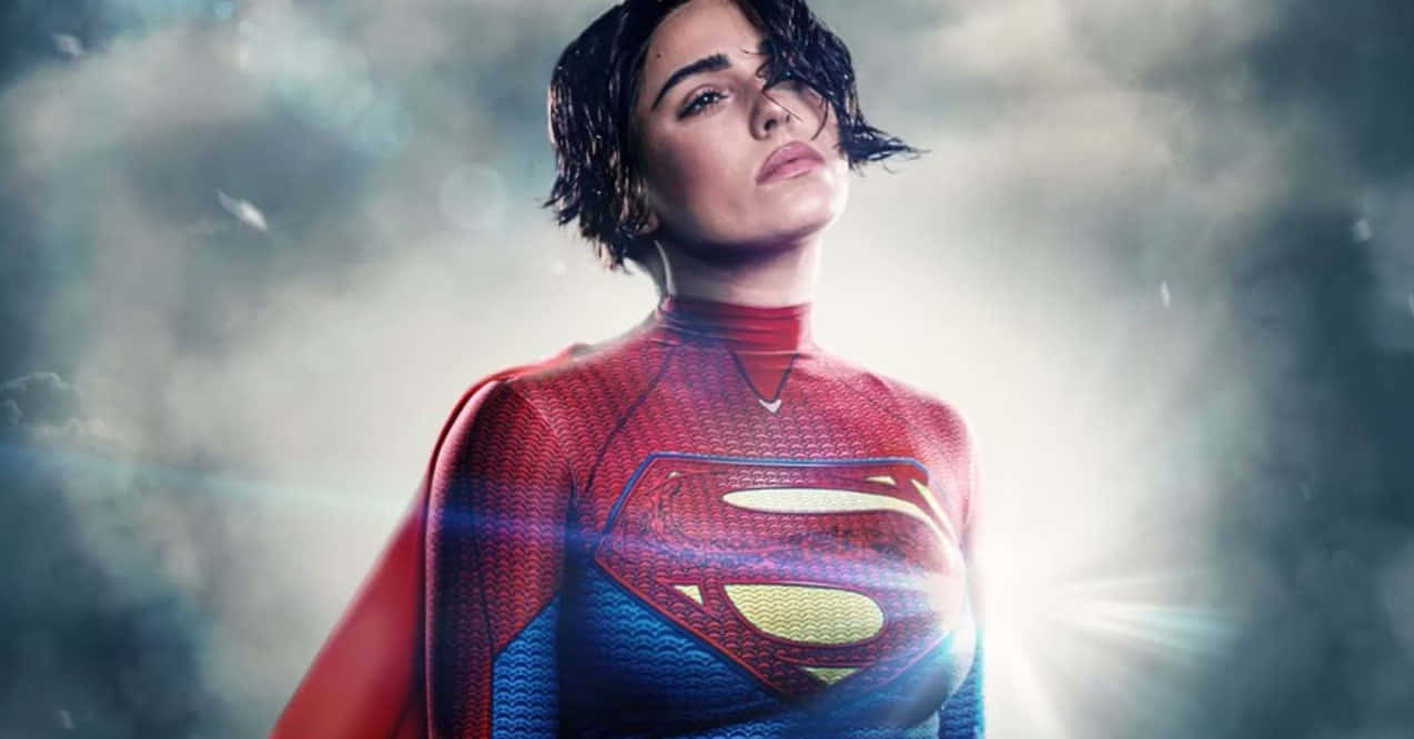 Sasha Calle Supergirl, red and blue suit, glowing 'S' emblem, SD Desktop Wallpaper
