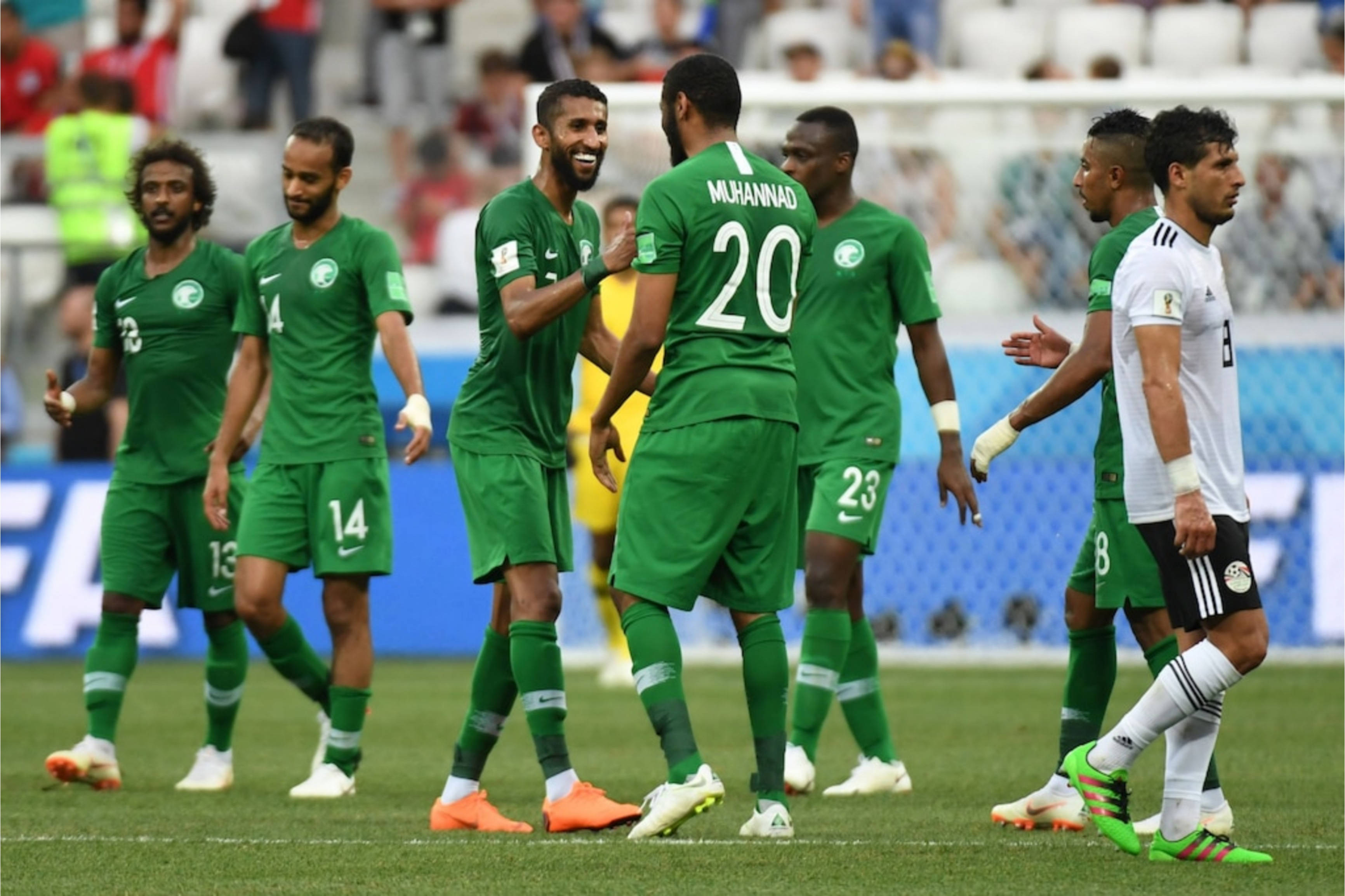 Saudi Arabia National Football Team, green jerseys, sunlit stadium field, 2K Desktop Wallpaper