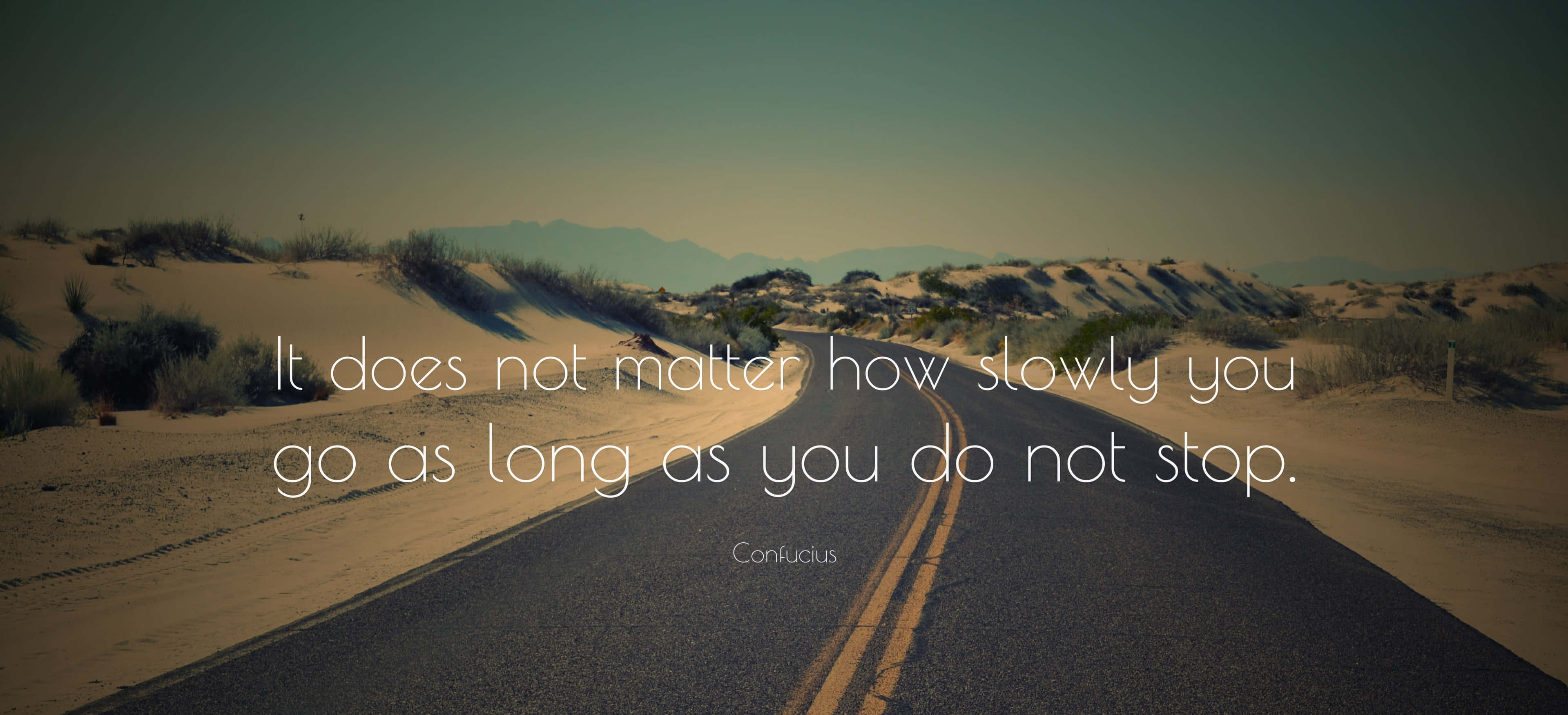 Saying, winding asphalt road, golden desert dunes, 2K Desktop Wallpaper