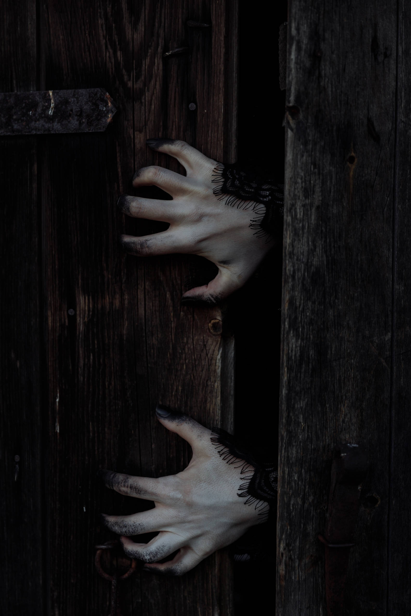scary iphone, dark wooden door, pale hands, 2K Phone Wallpaper