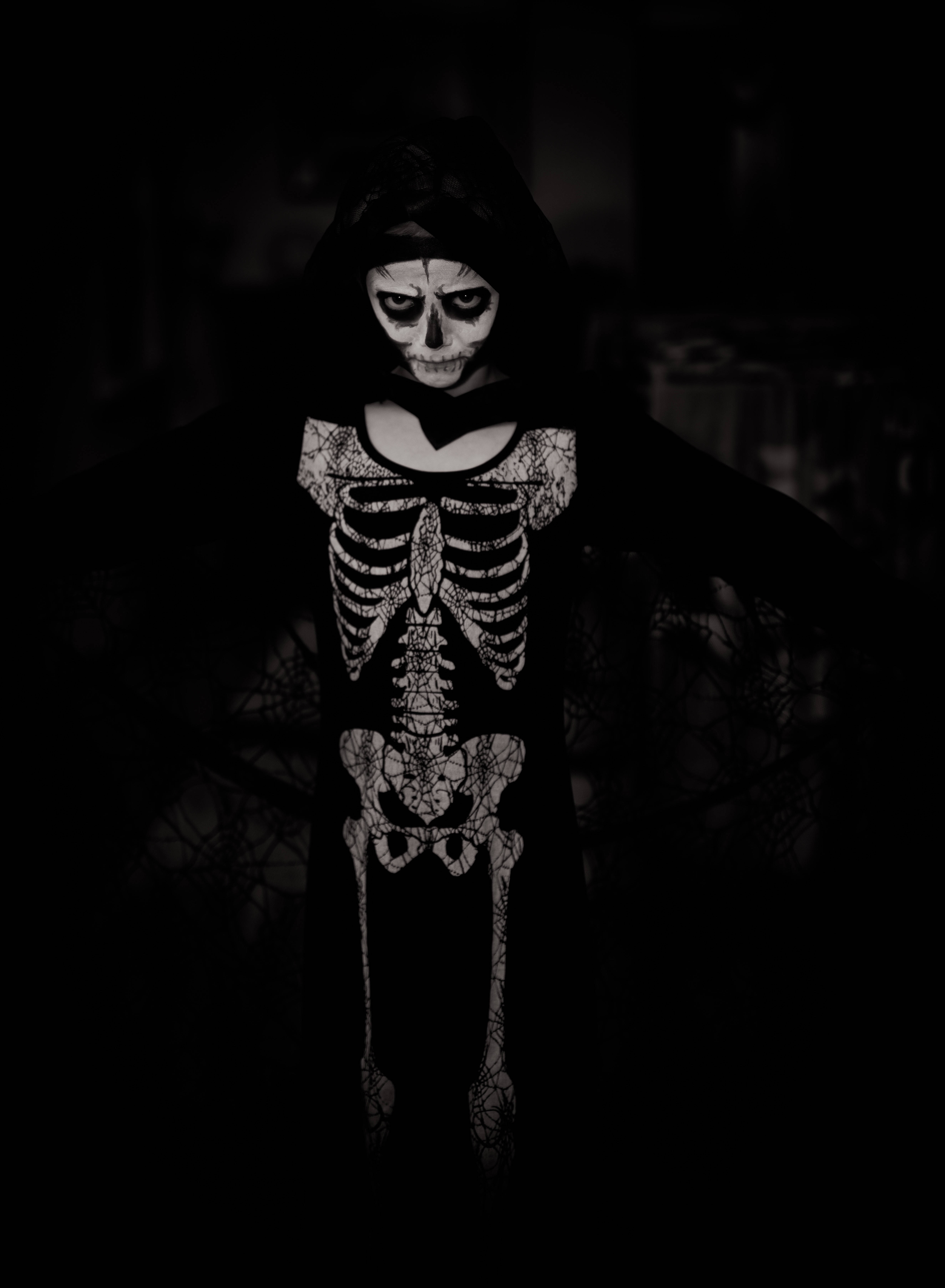 Halloween Costume Skeleton, hooded skeleton costume, glowing white bone patterns, 5K Phone Wallpaper