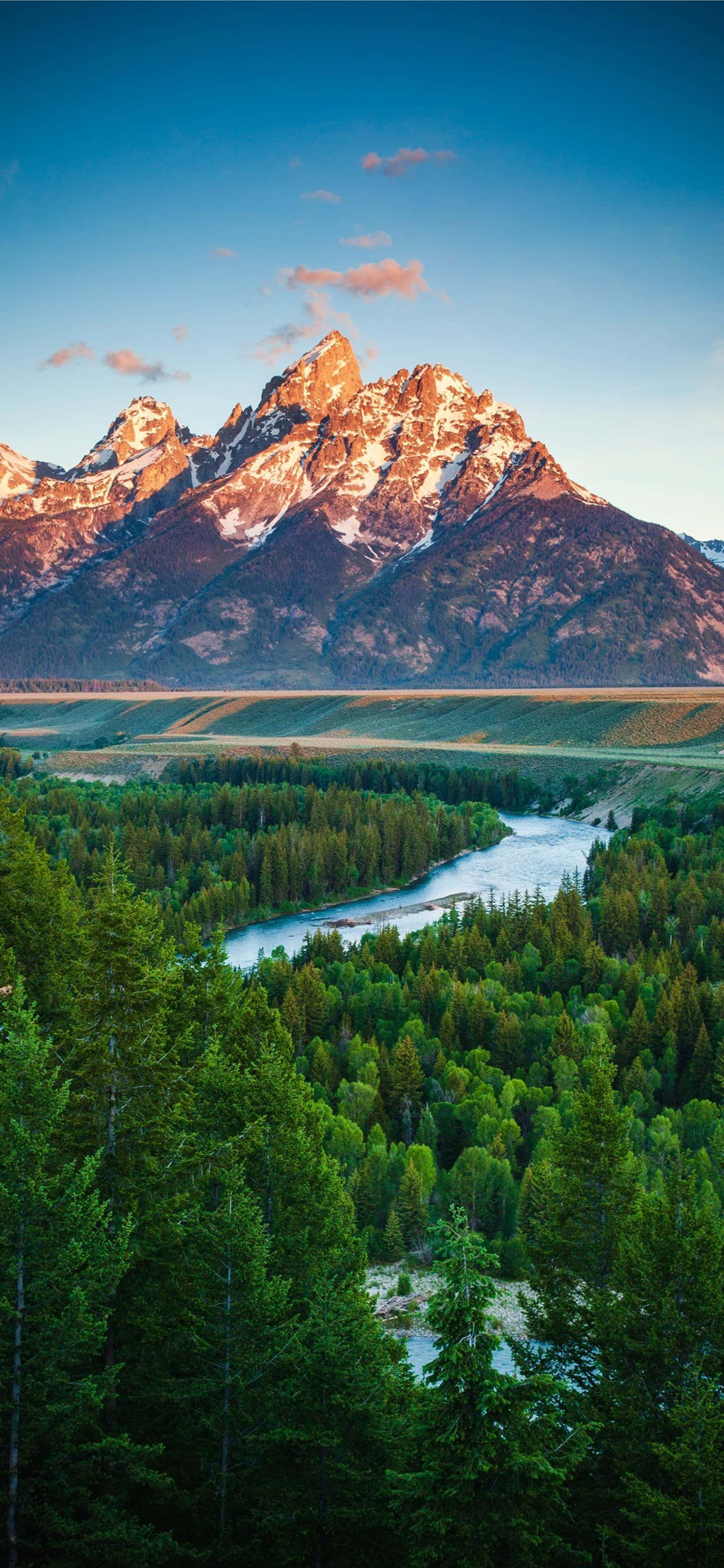 Mountain Ranges, snow-capped peaks, golden sunset light, 4K Phone Wallpaper