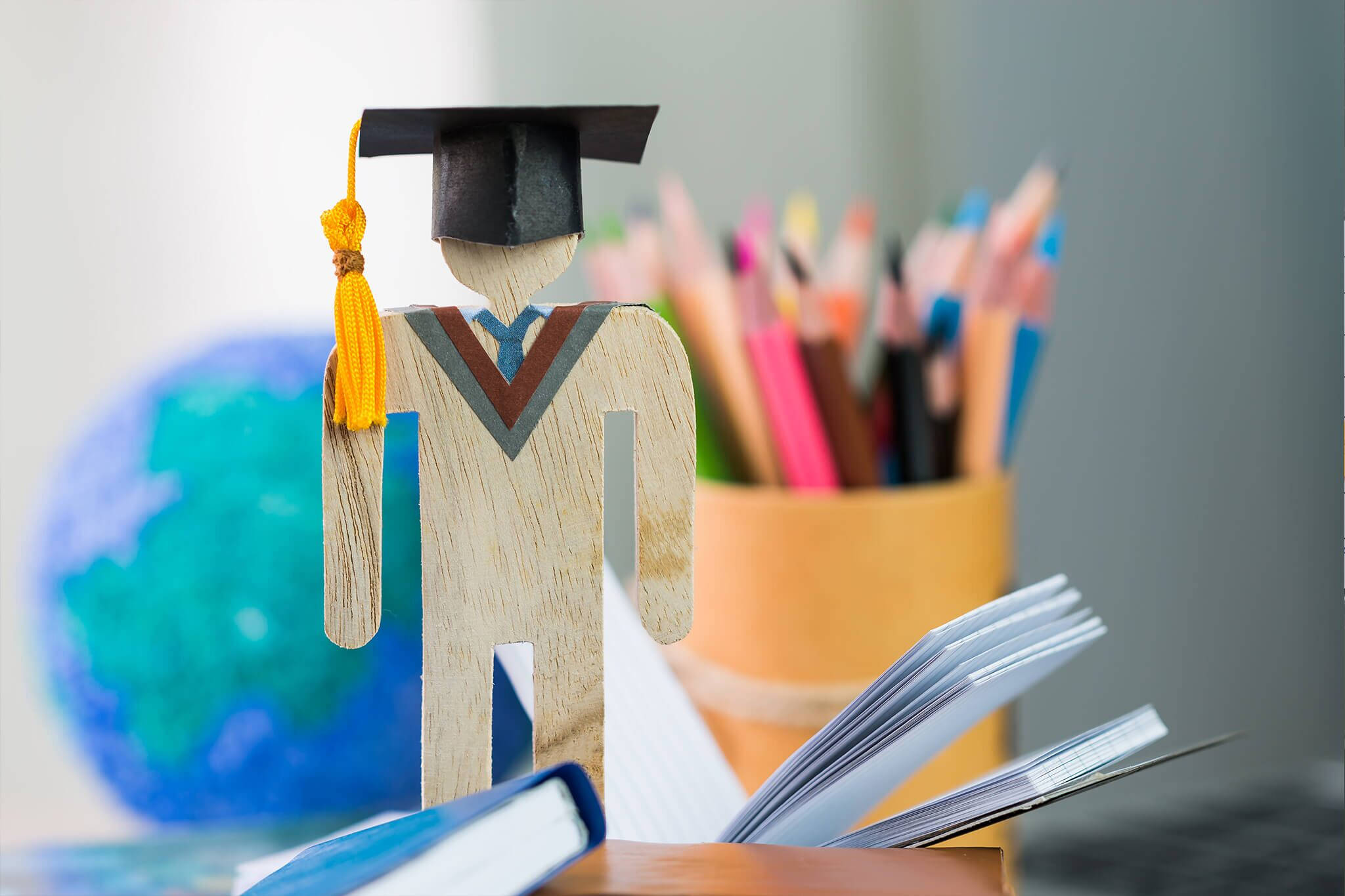 wooden graduation figurine, open book, colorful pencils, Full HD Desktop Wallpaper