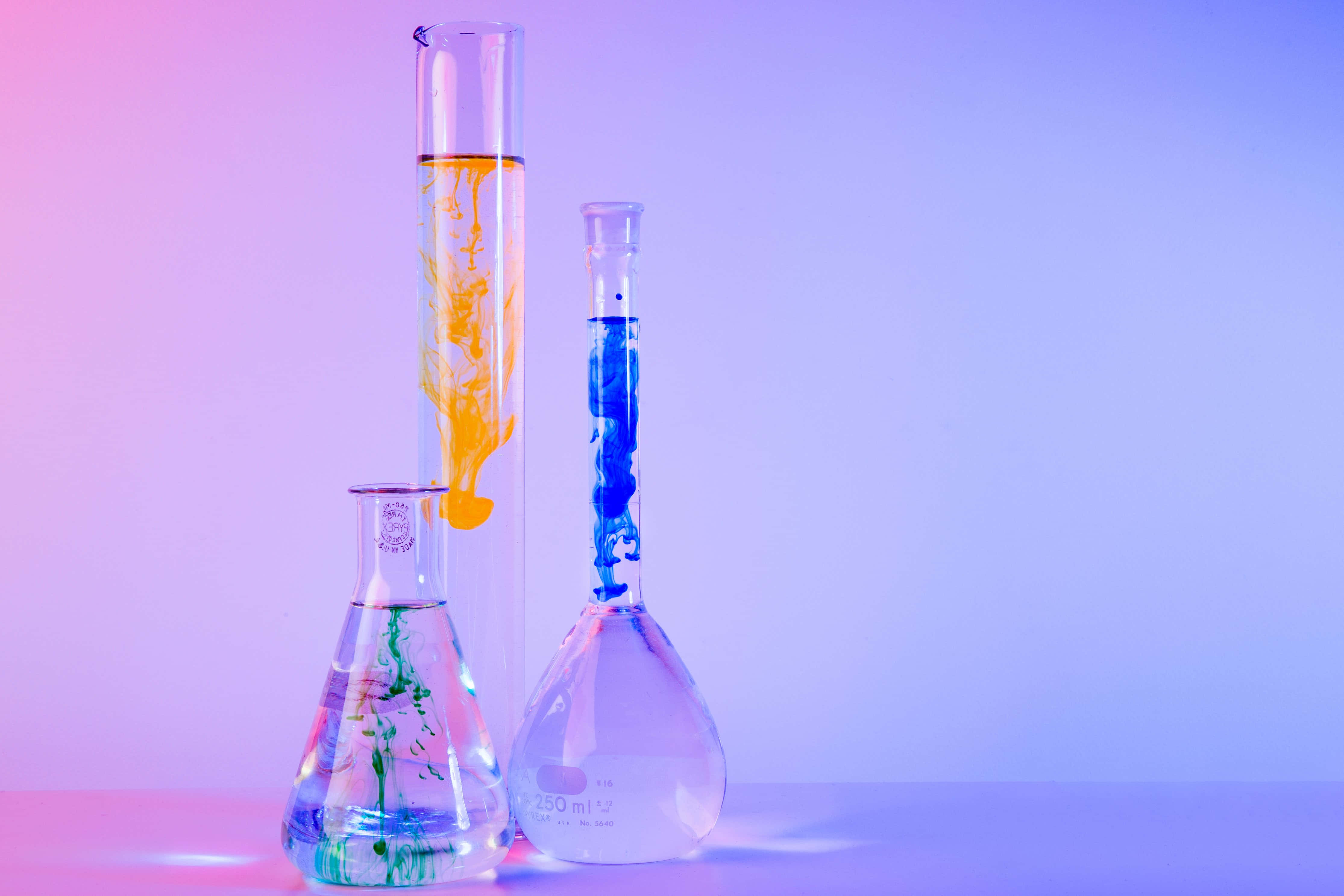 colorful laboratory glassware, orange blue and green liquids, gradient pink to blue background, 4K Desktop Wallpaper