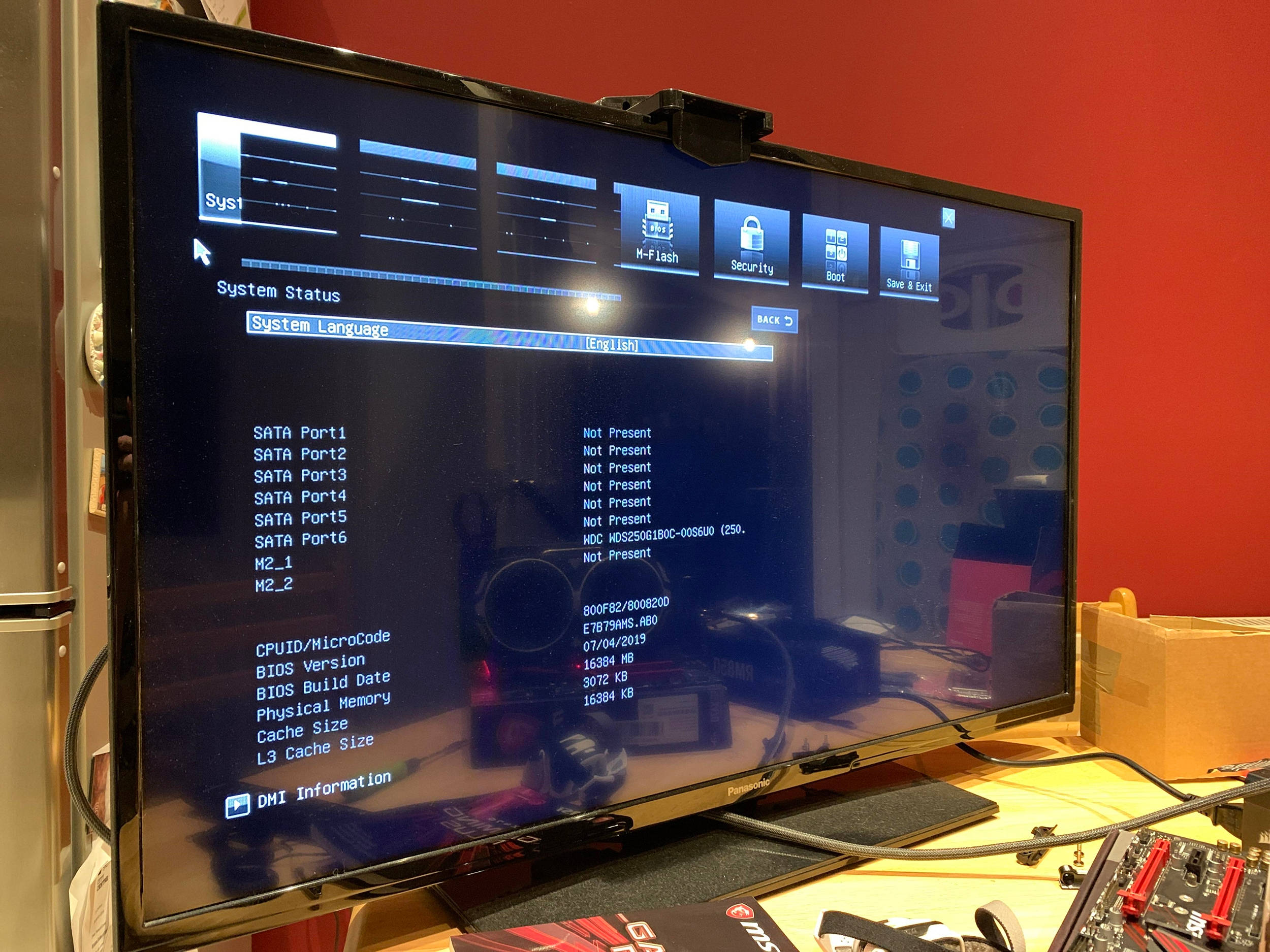 BIOS system status screen, red wall, desk clutter, Full HD Desktop Wallpaper
