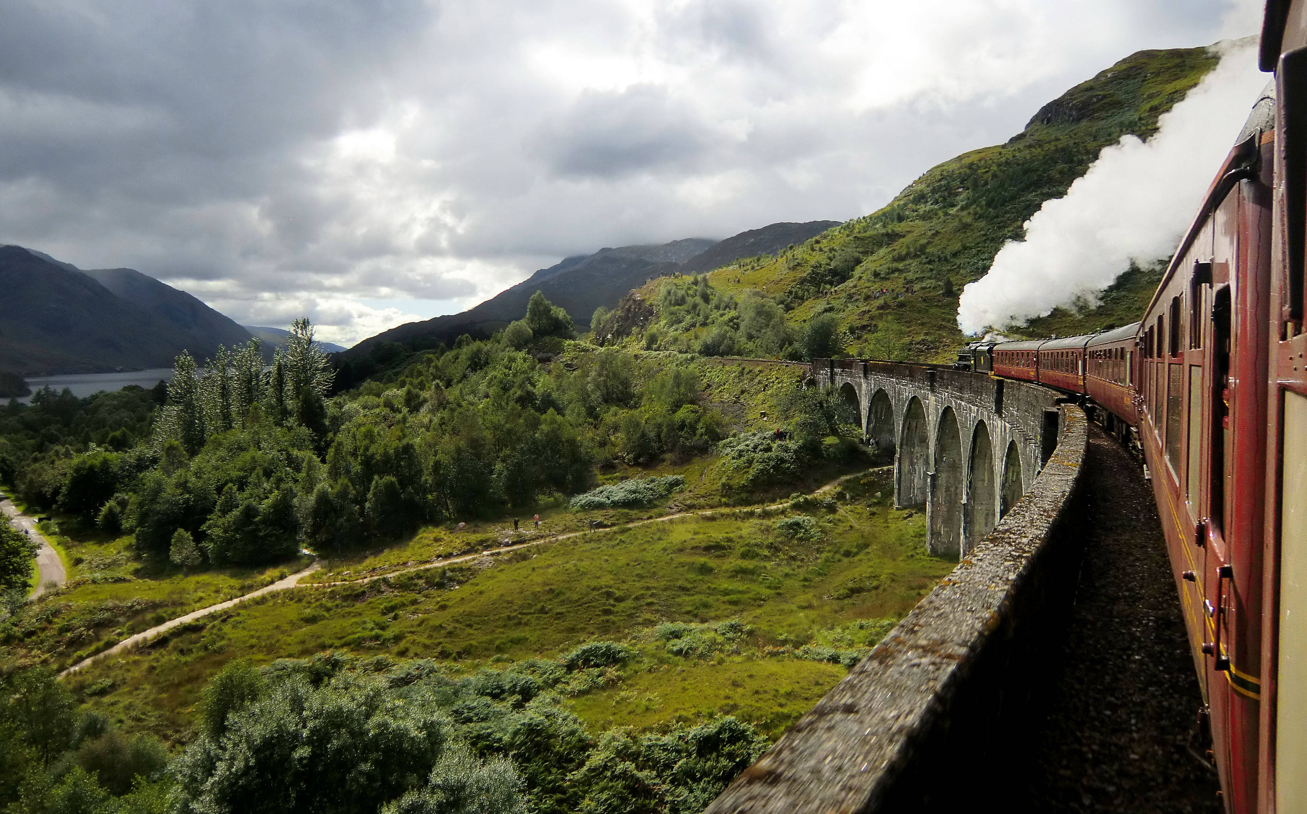 red steam train, stone viaduct, lush green Scottish Highlands, 4K Desktop Wallpaper